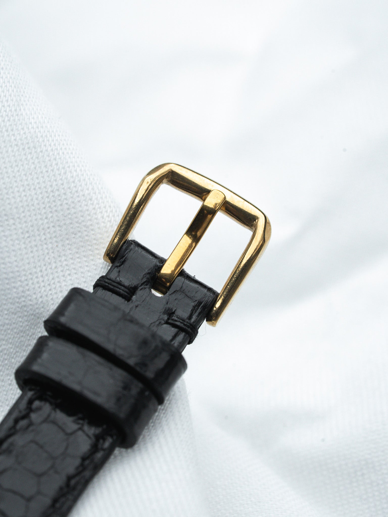 Black alligator strap with gold buckle, vintage luxury watch accessory