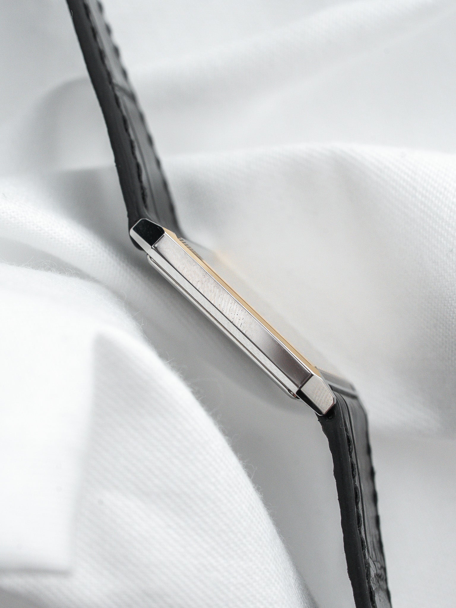Cartier Tank vintage watch with black leather strap and gold accents