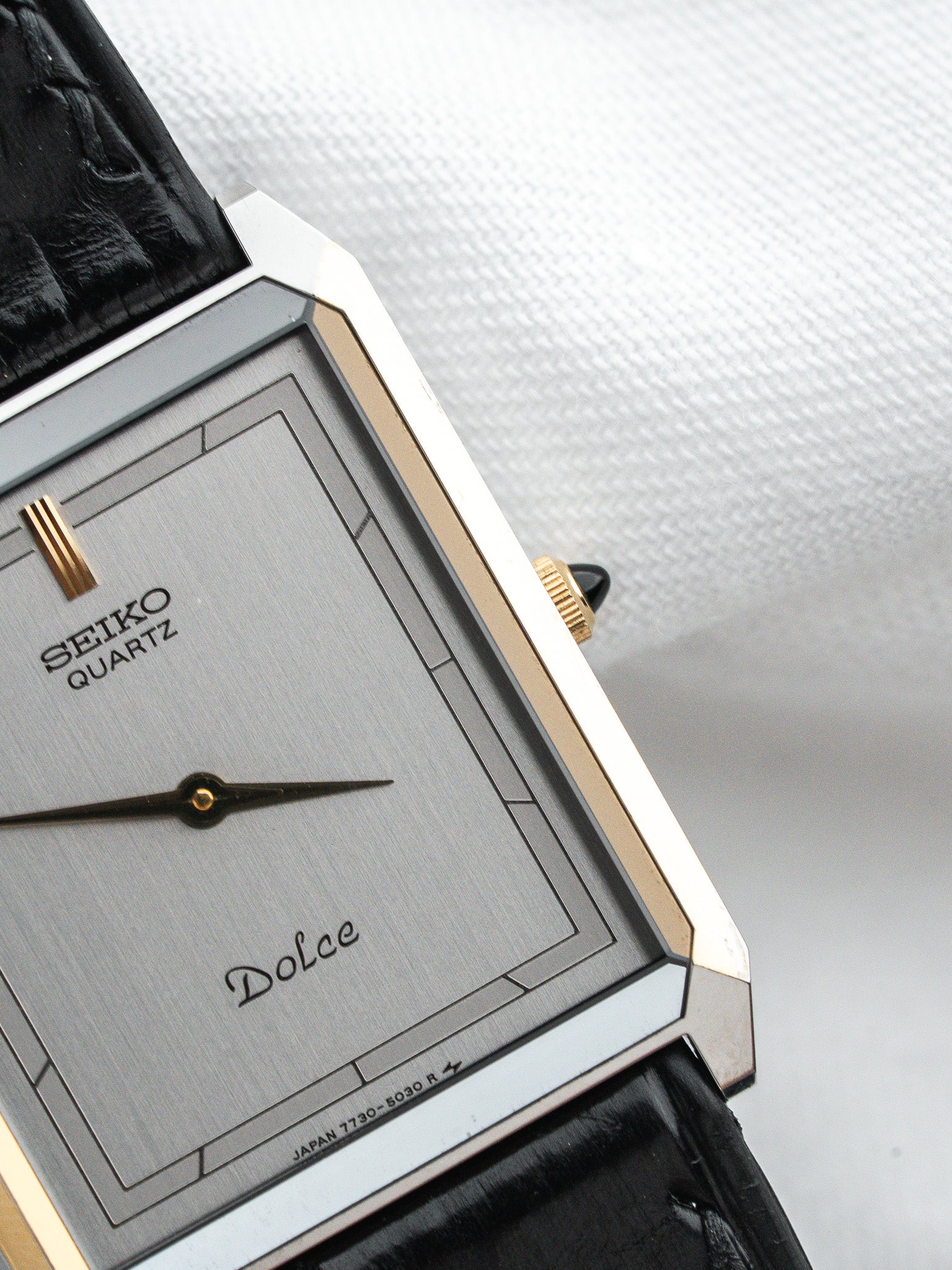Seiko Dolce vintage quartz watch with silver dial and black leather strap