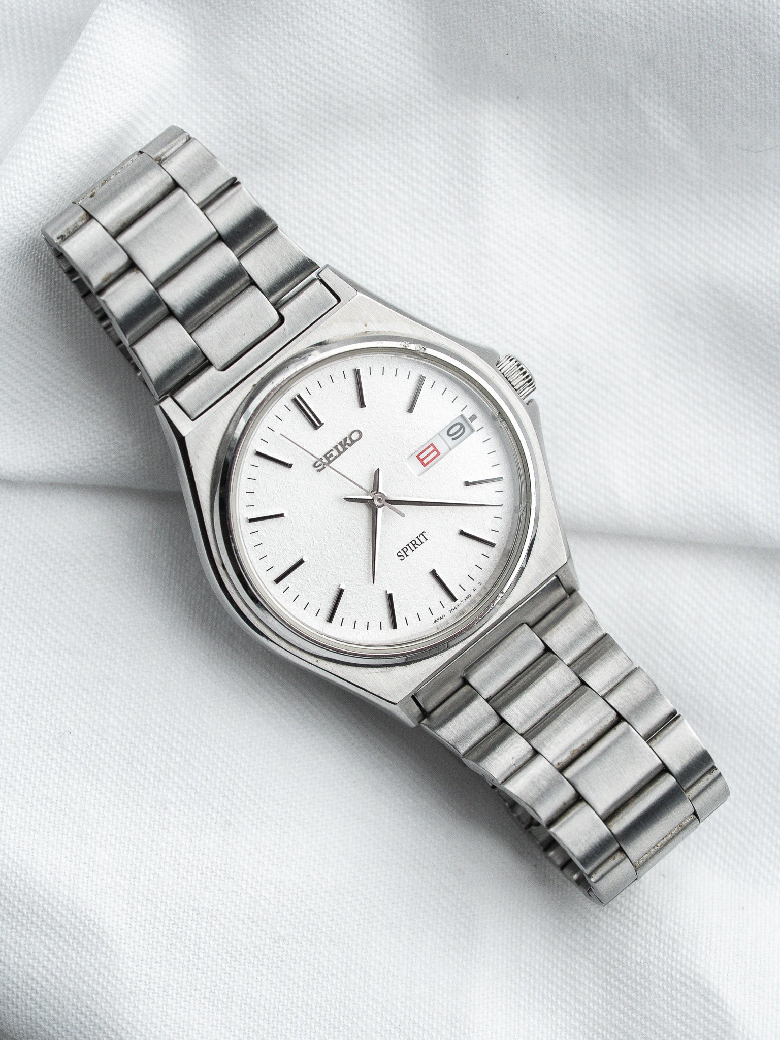 Seiko Spirit 7N43-7180 Acier — Cadran Blanc Sablé Jour Kanji (1998)