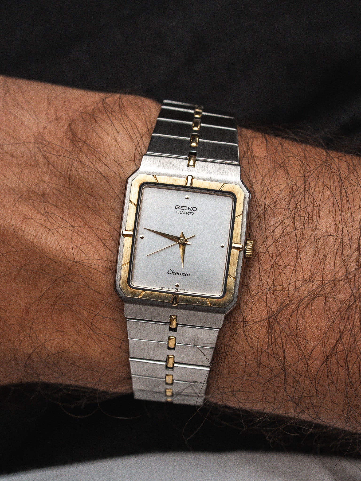 Seiko Chronos vintage watch with silver dial, gold accents, worn on wrist