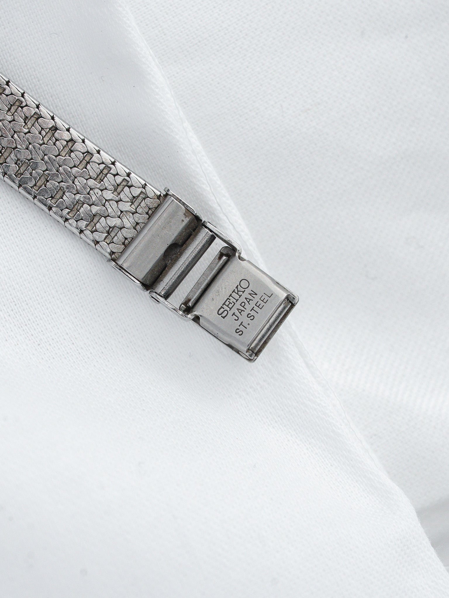 Seiko vintage watch bracelet with textured stainless steel and engraved clasp