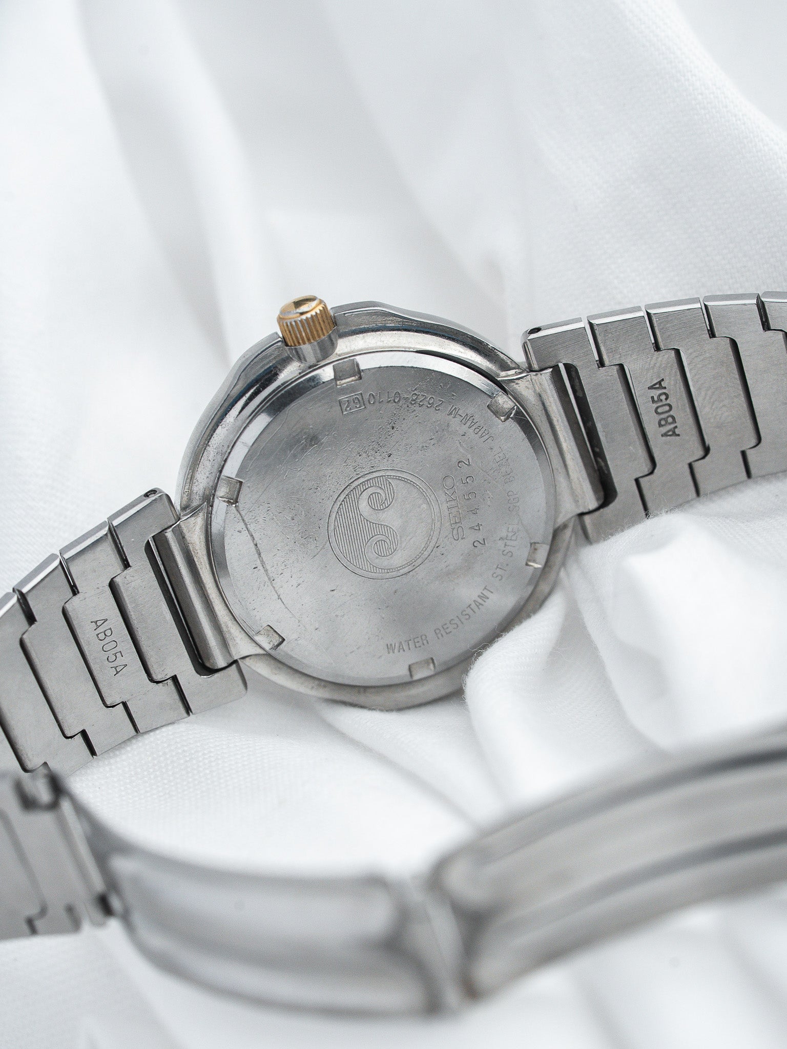 Seiko vintage watch back with engraved logo, stainless steel case and bracelet