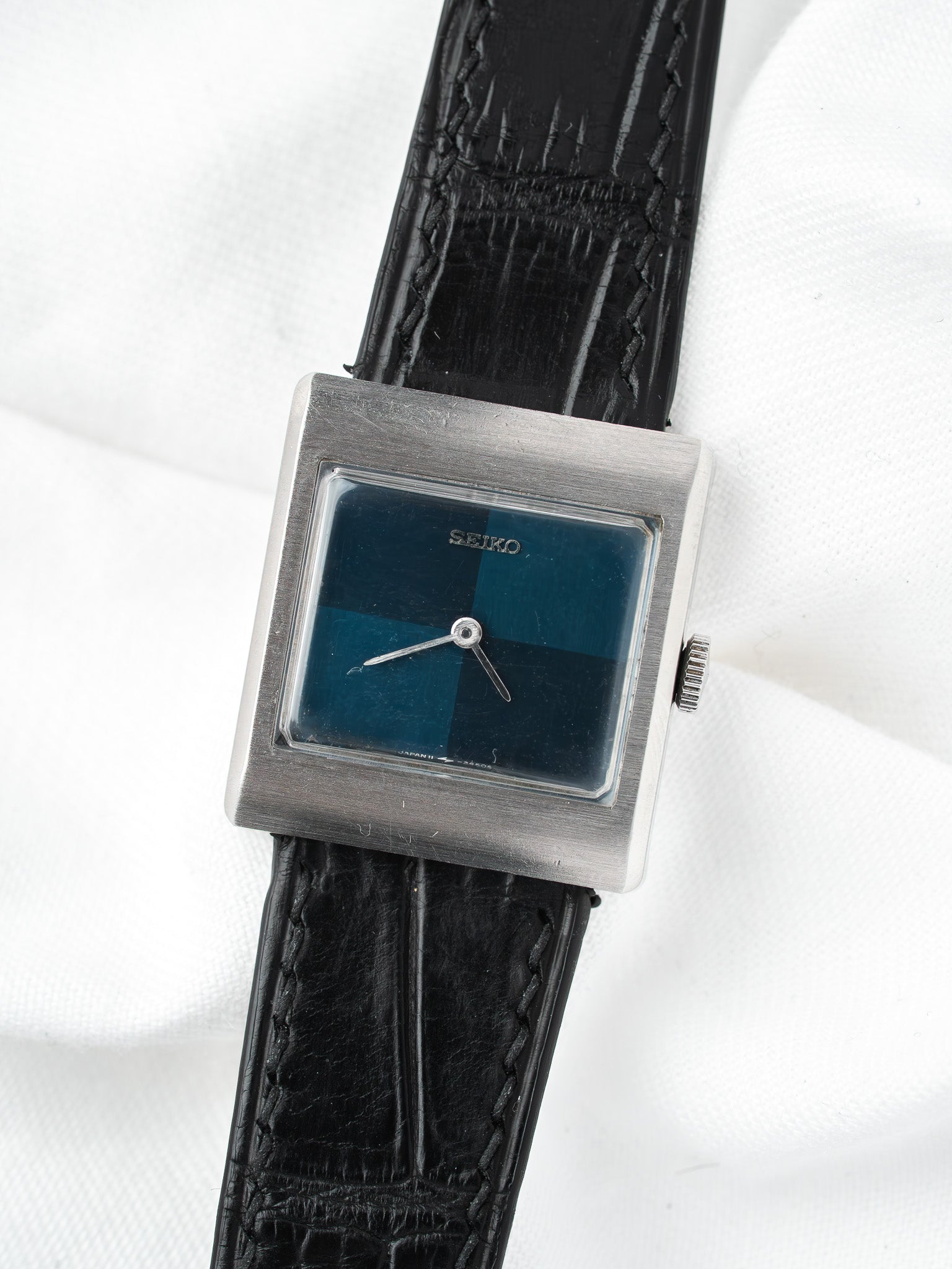 Seiko vintage watch with square case, blue dial, black leather strap