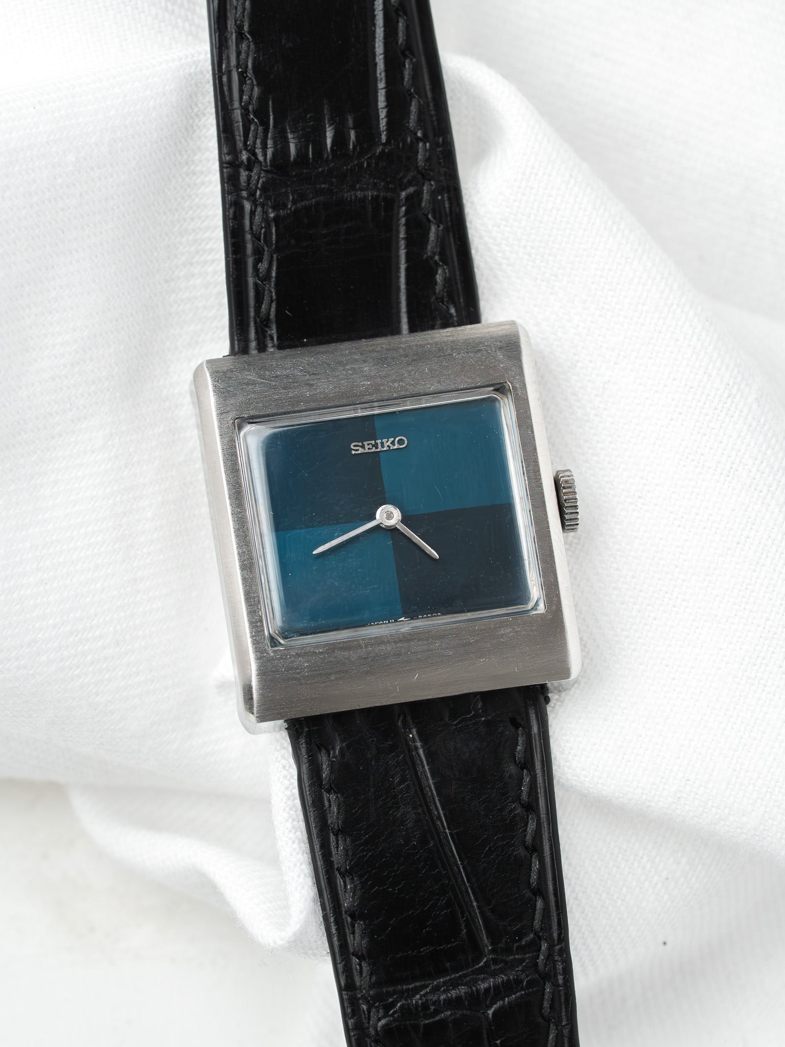 Seiko vintage watch with square case, blue dial, black leather strap