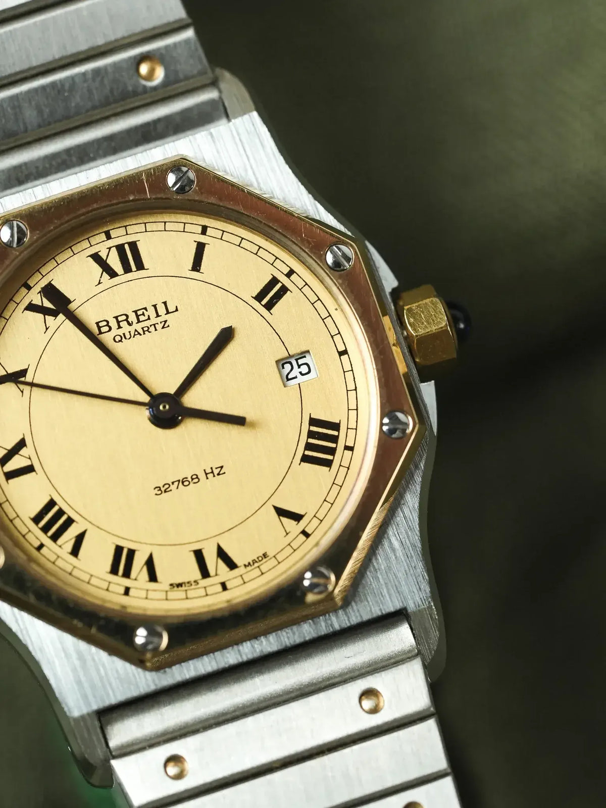 Breil Quartz vintage watch with gold dial, Roman numerals, and two-tone steel bracelet