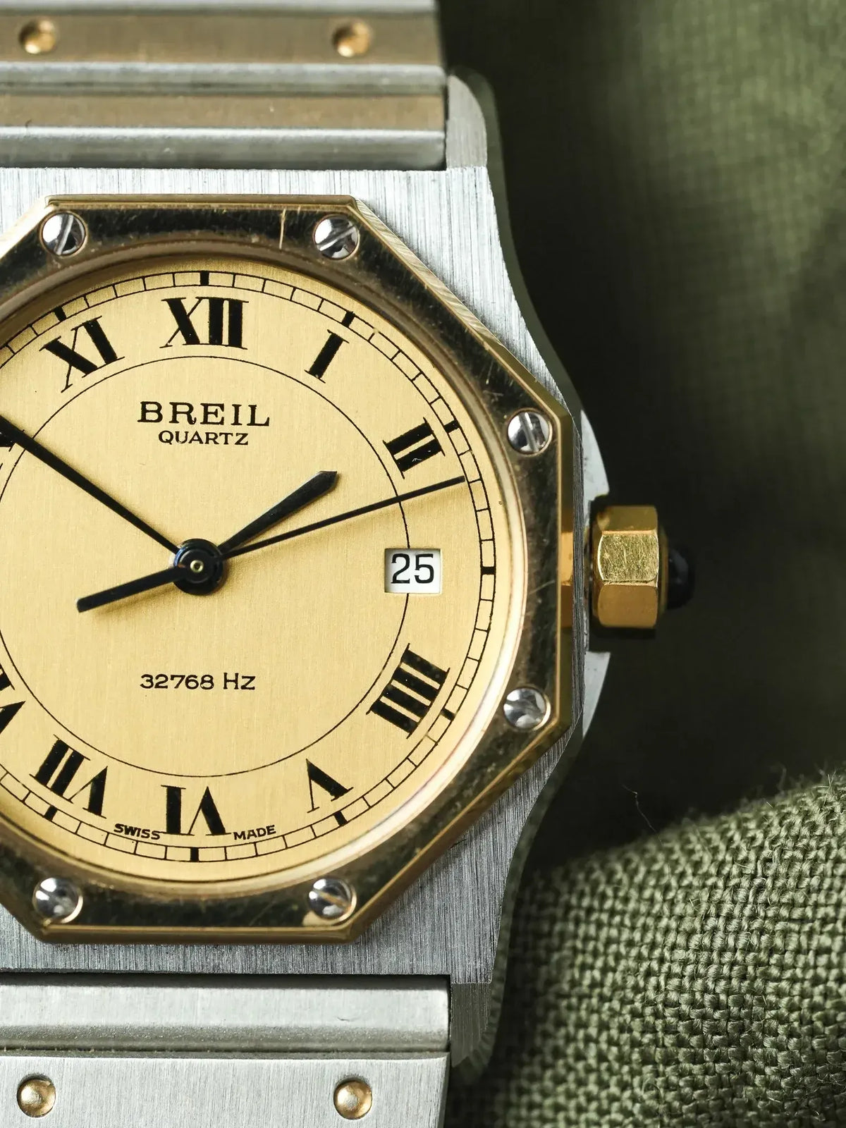 Breil Quartz vintage watch with gold dial, Roman numerals, and steel case