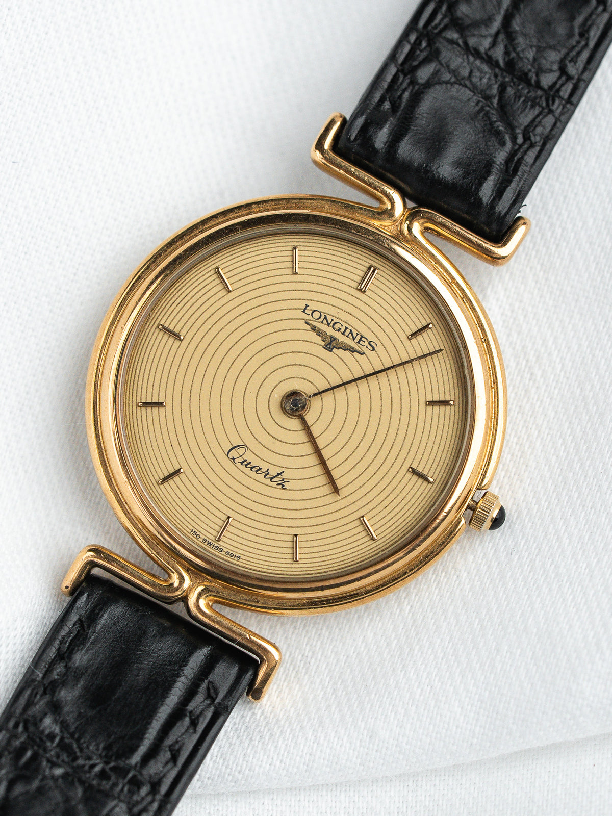 Longines Quartz vintage watch with gold case, cream dial, black leather strap