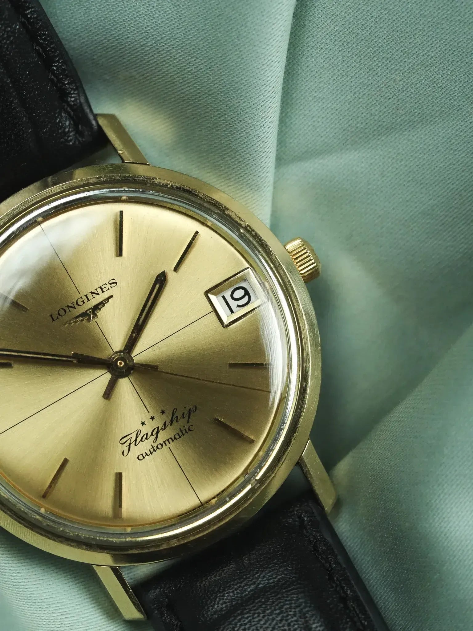 Longines Flagship vintage automatic watch with gold dial, black leather strap, date window