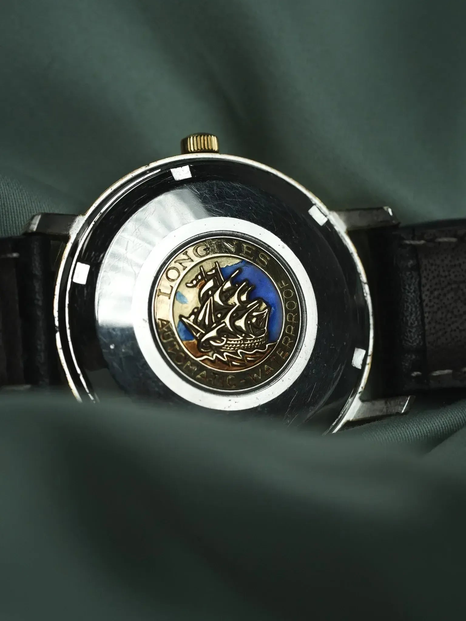 Longines vintage watch back with ship emblem, automatic waterproof engraving, leather strap