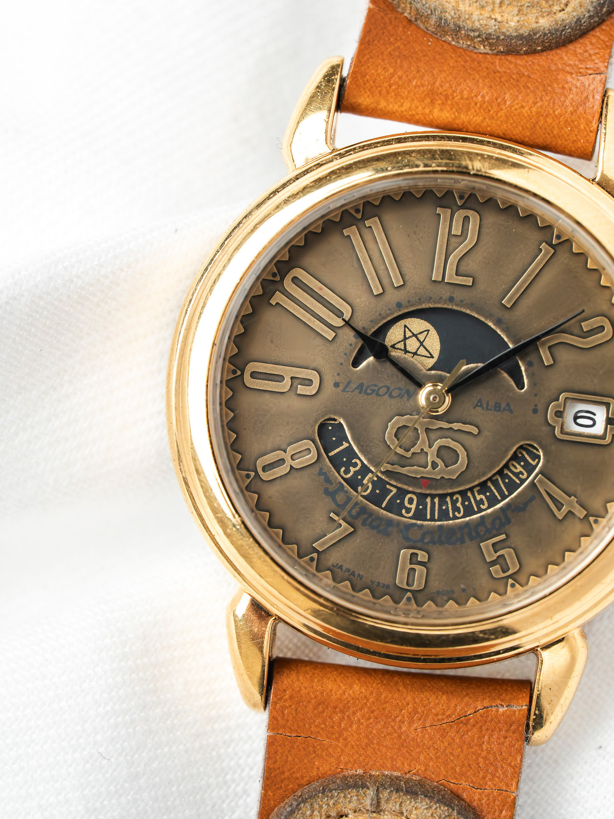 Lagoon Alba vintage watch with gold case, brown dial, lunar calendar, and leather strap