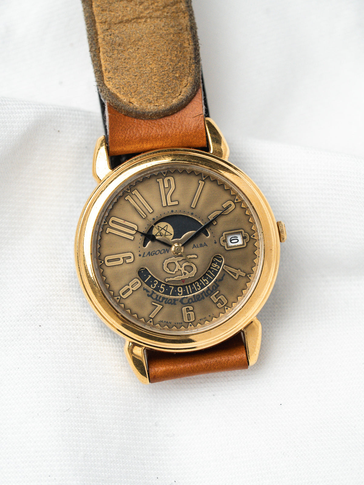 Lagoon Alba vintage watch with gold case, brown leather strap, lunar calendar dial