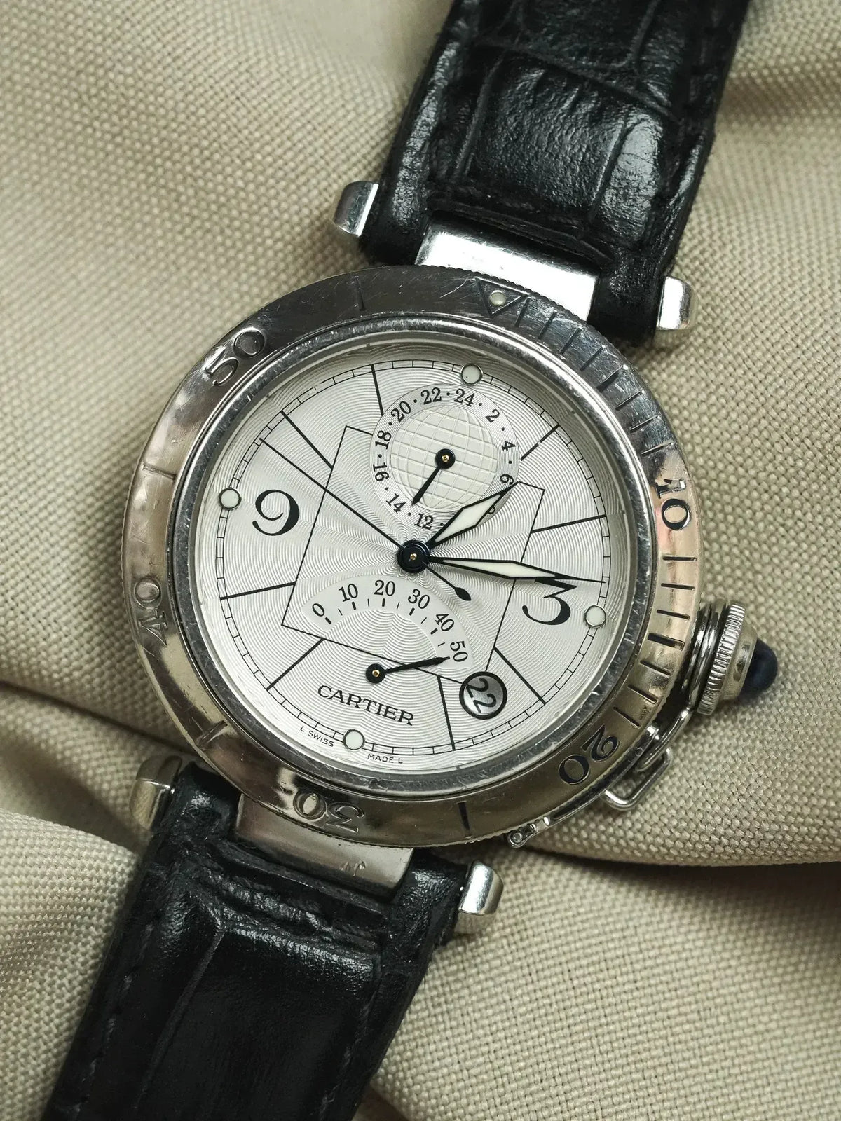 Cartier Pasha vintage watch with silver dial, black leather strap, and steel case
