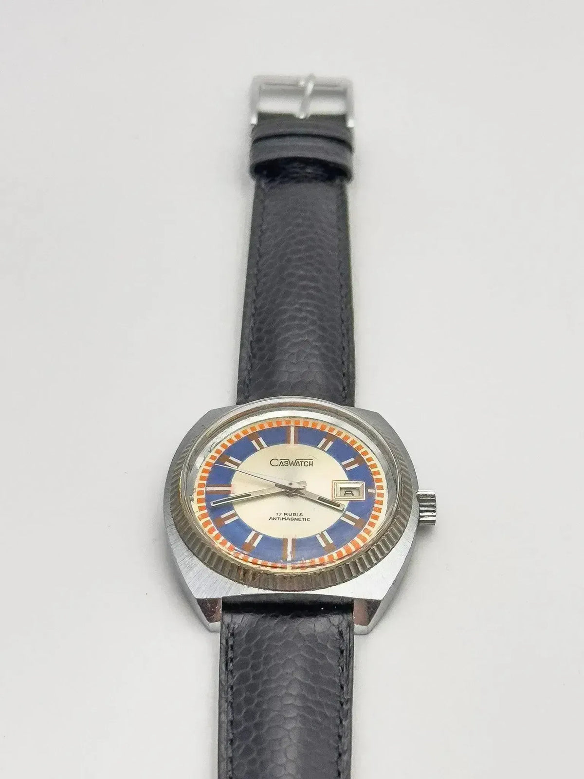 Caswatch vintage watch with blue and orange dial, black leather strap, stainless steel case
