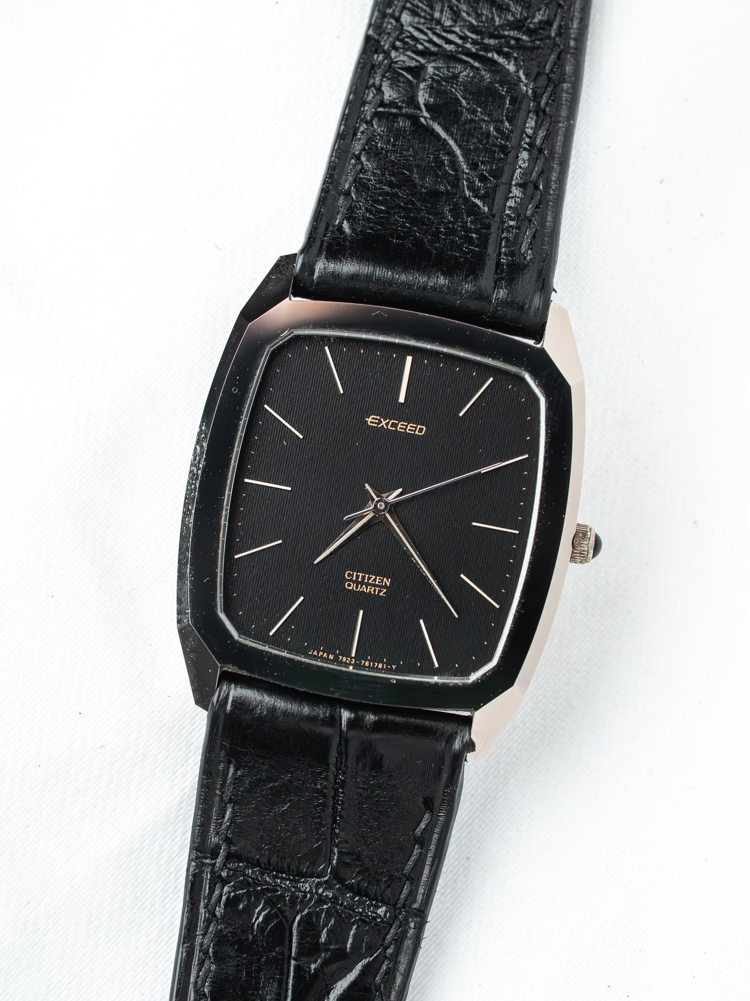 Citizen Exceed vintage watch with black dial, silver hands, and textured black strap