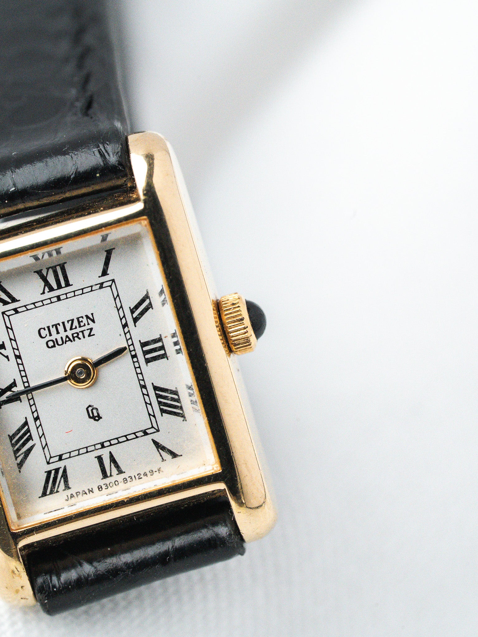 Citizen Quartz vintage watch, gold case, white dial with Roman numerals, black leather strap
