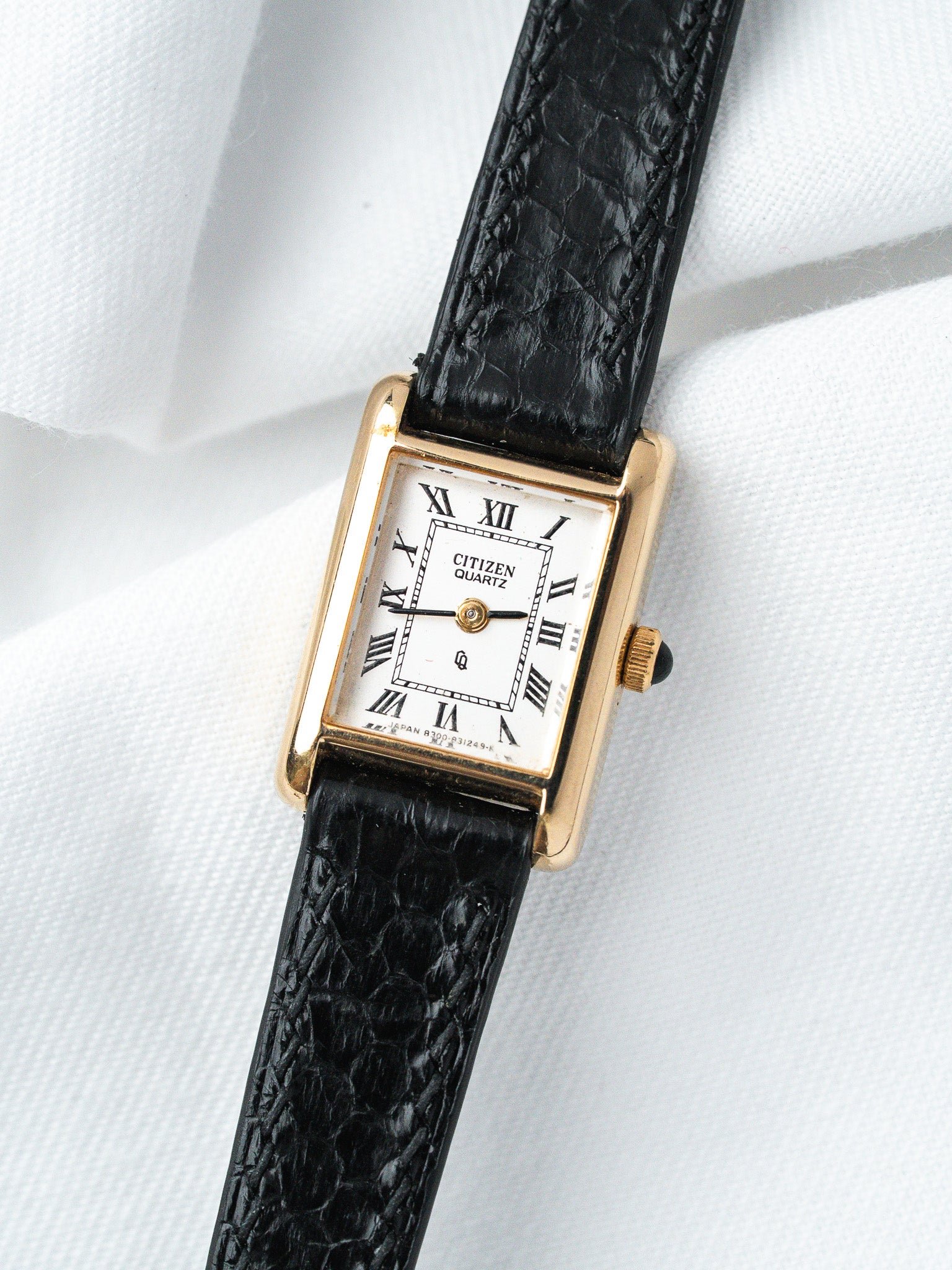 Citizen Quartz vintage watch with gold case, white dial, Roman numerals, black alligator strap