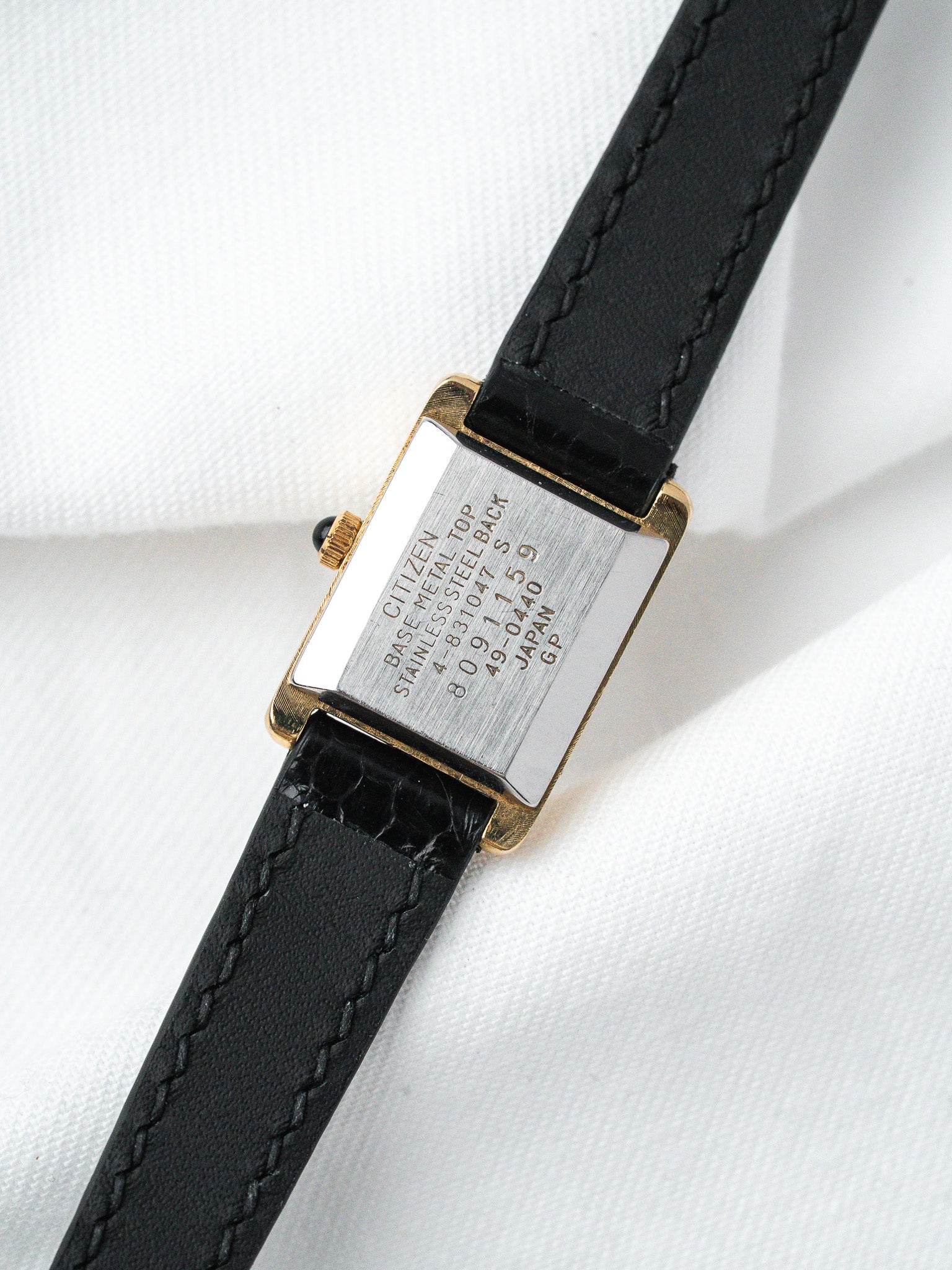 Citizen vintage watch with gold-tone case, black leather strap, stainless steel back