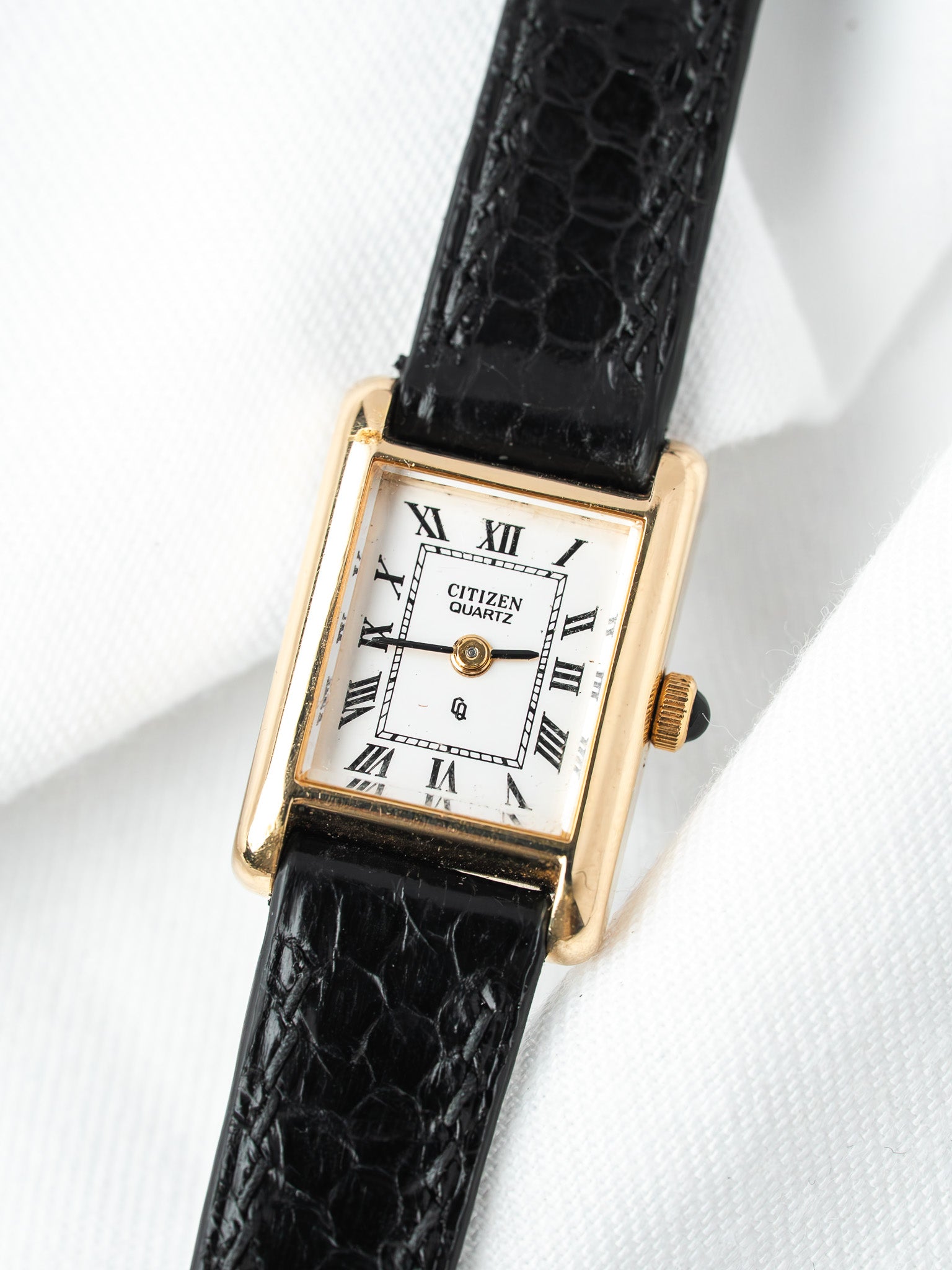 Citizen Quartz vintage watch with gold case, white dial, Roman numerals, black alligator strap