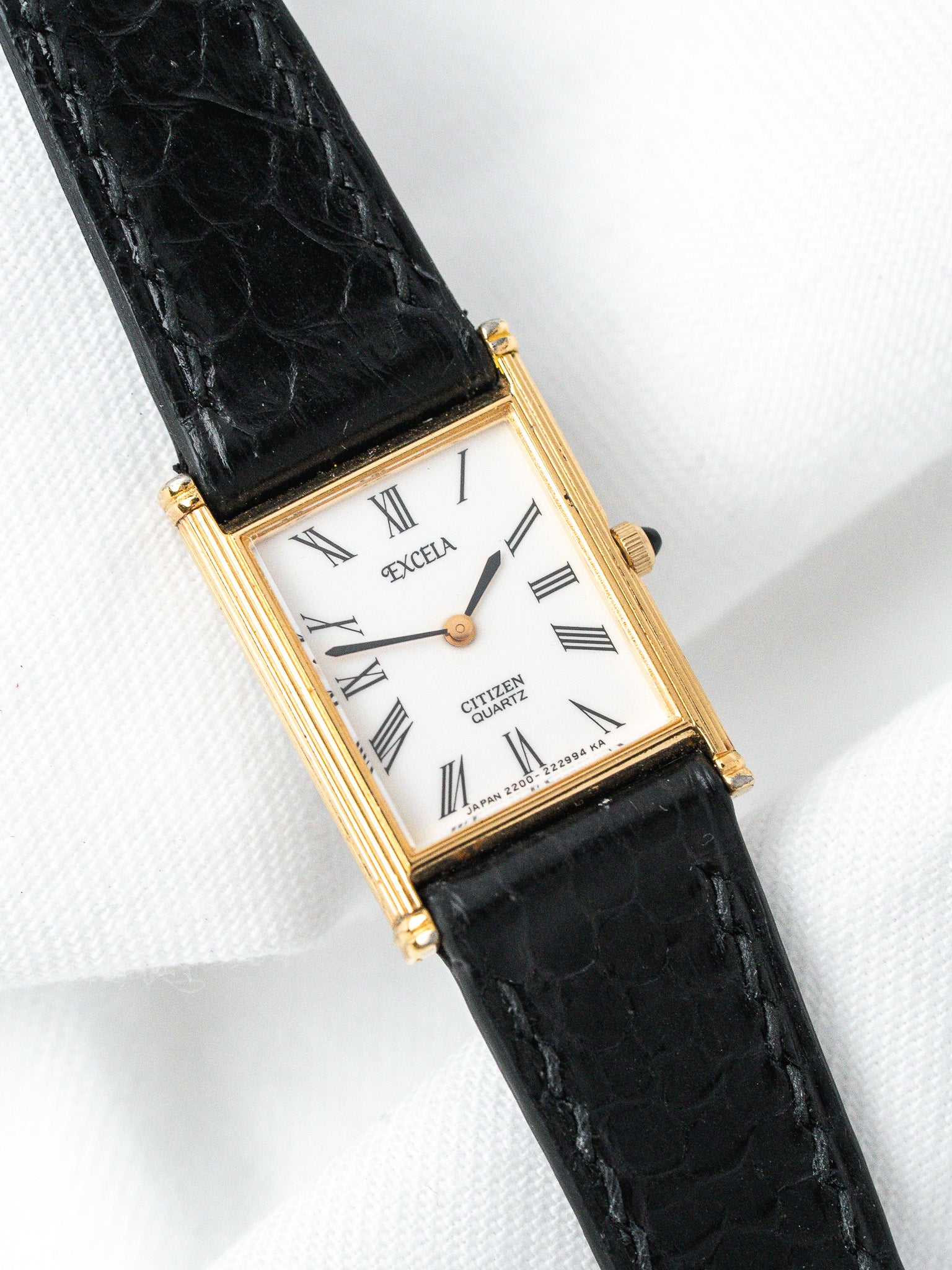 Citizen Excelsa vintage watch with gold case, white dial, Roman numerals, black leather strap