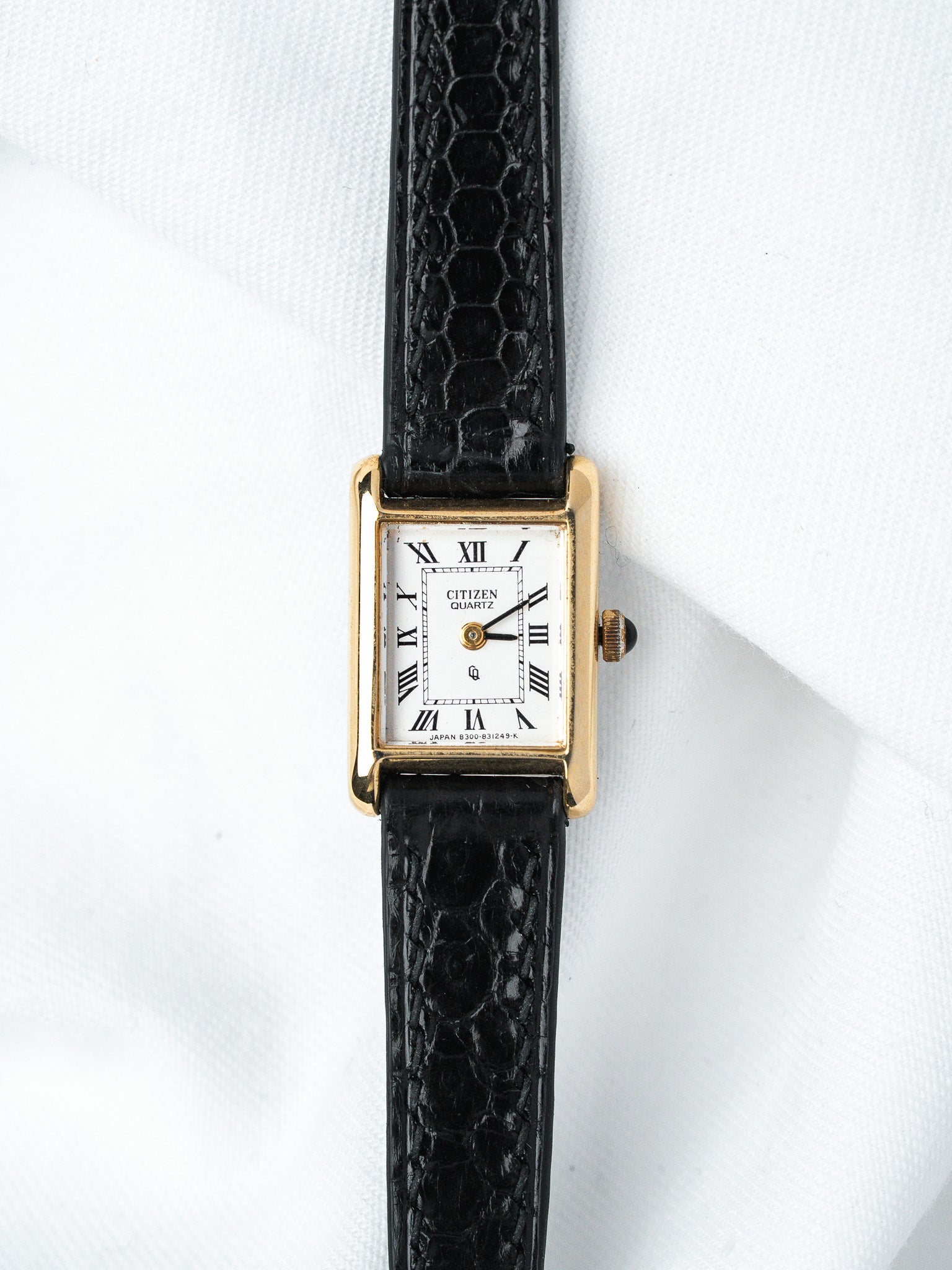 Citizen Quartz vintage watch with gold case, white dial, Roman numerals, black alligator strap