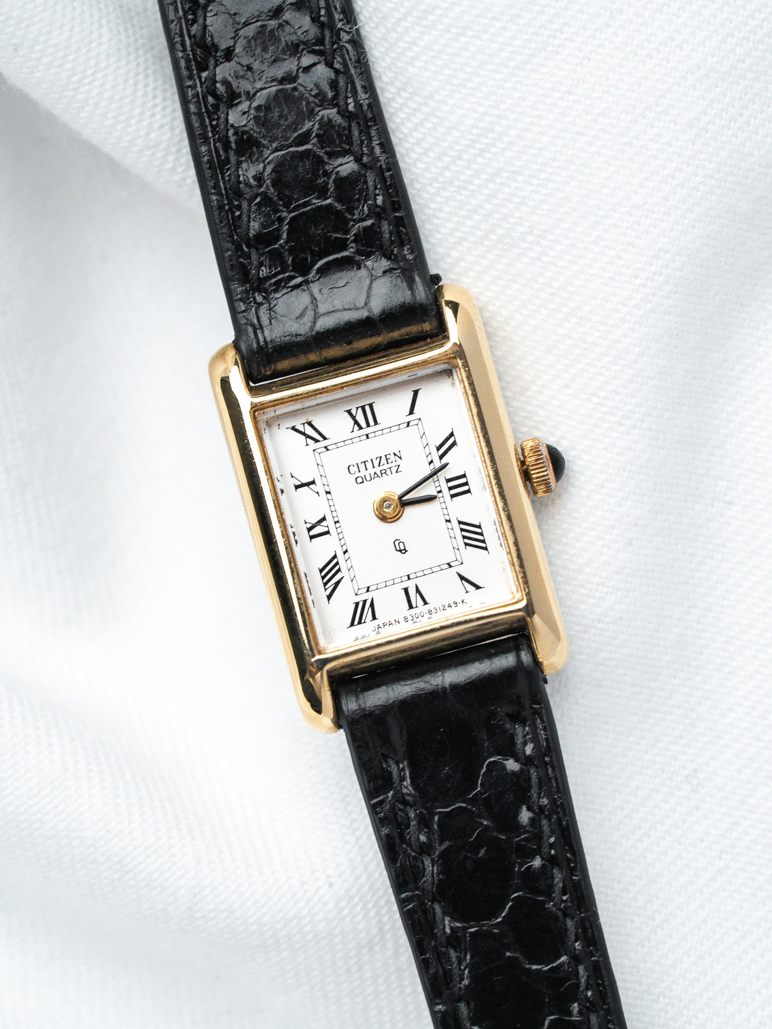 Citizen Quartz vintage watch with gold case, white dial, Roman numerals, black crocodile strap