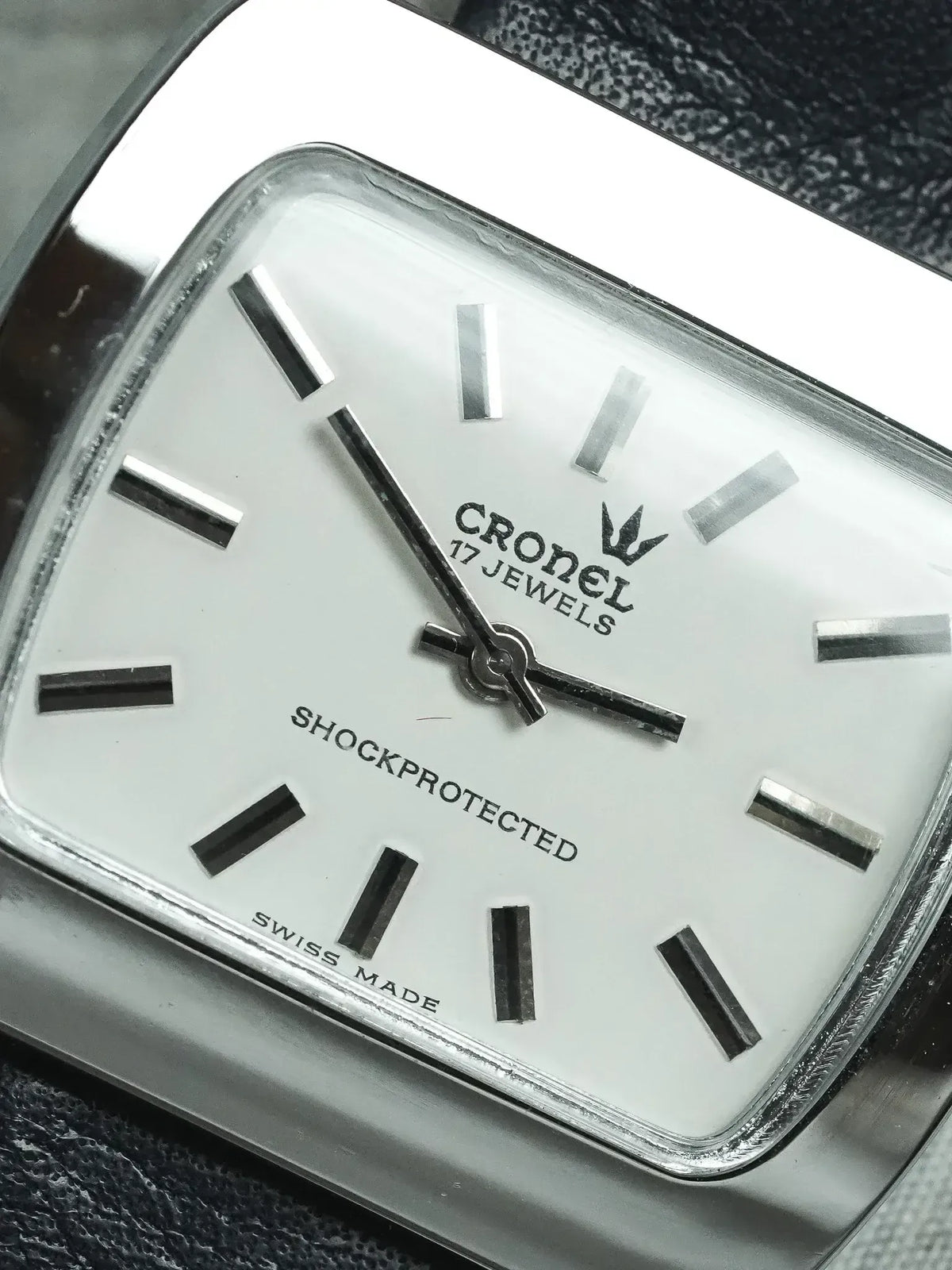Cronel vintage watch with white dial, silver markers, and shockprotected Swiss made movement