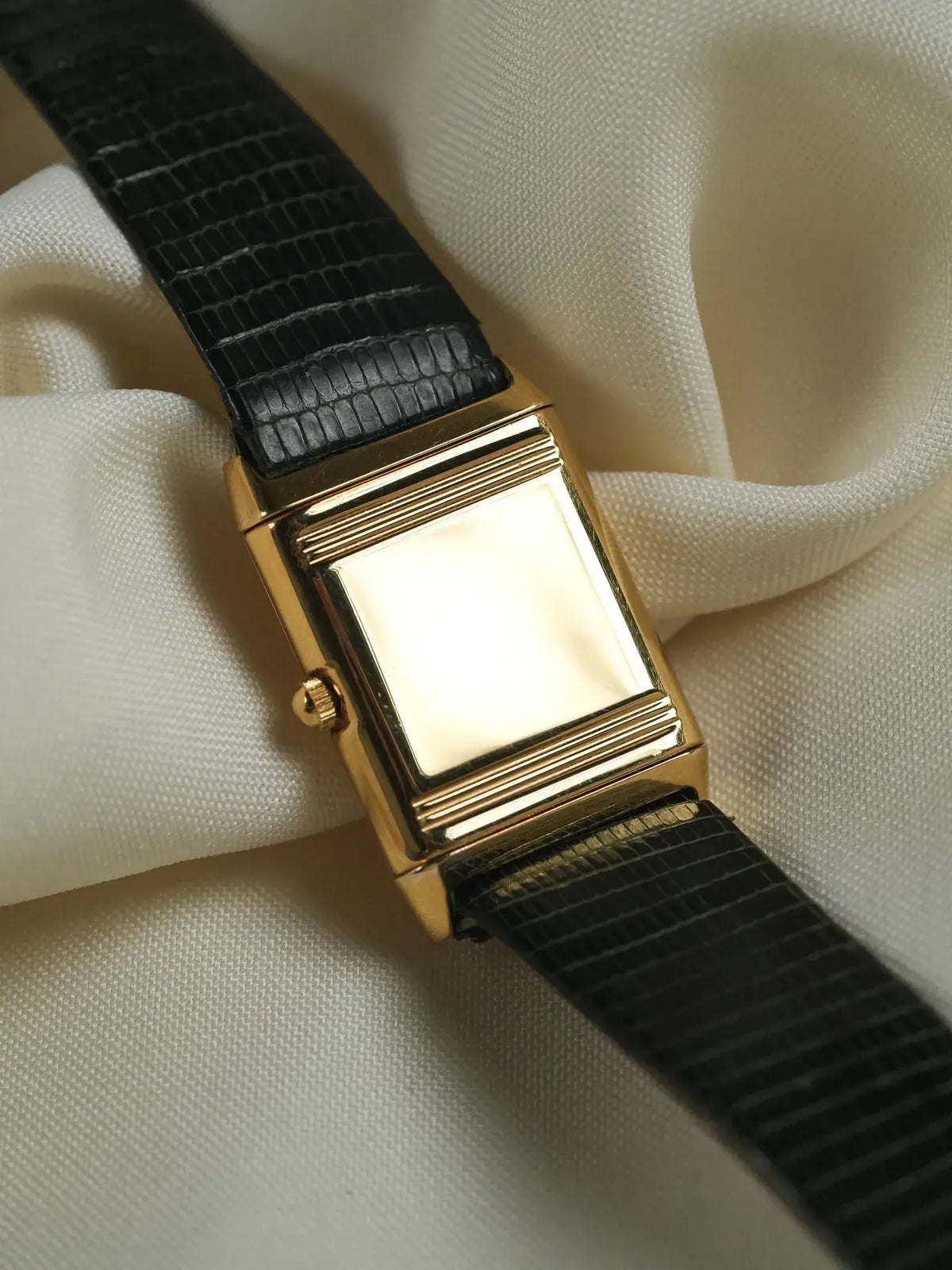 Vintage Cartier watch with gold rectangular case and black alligator strap