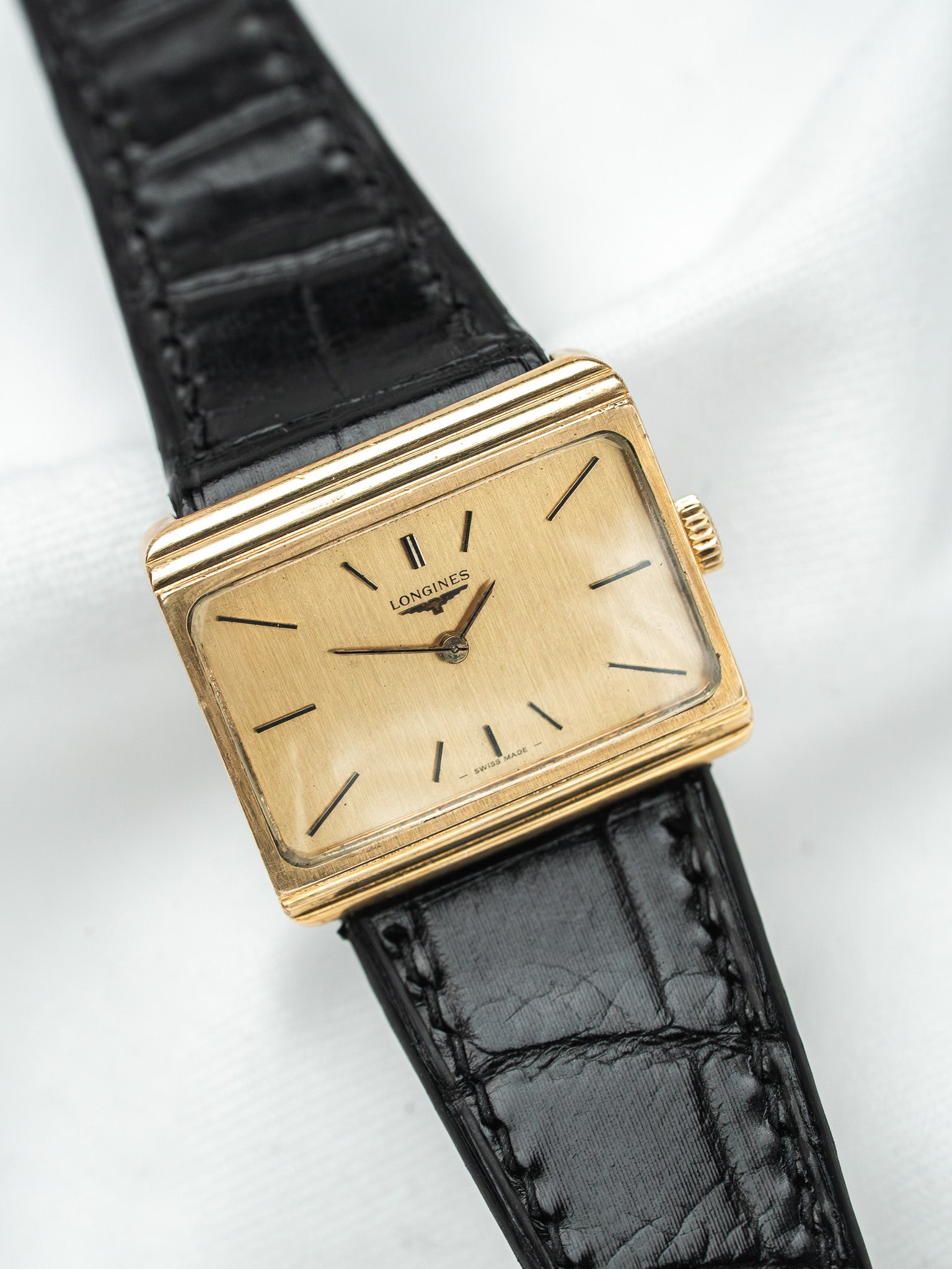 Longines vintage watch with gold case, champagne dial, black alligator strap