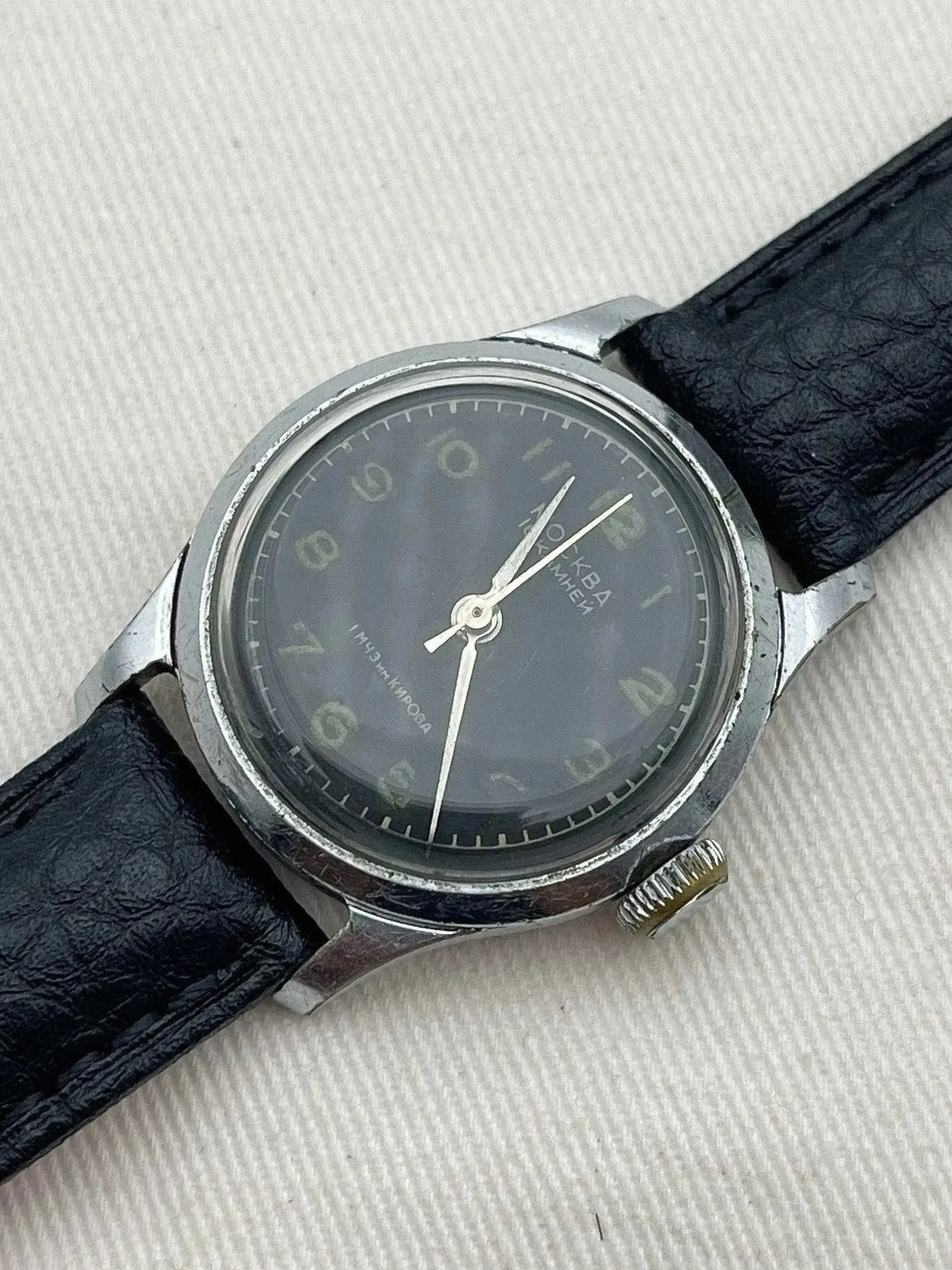 Vintage Moscow Kirov watch with dark dial, steel case, black leather strap