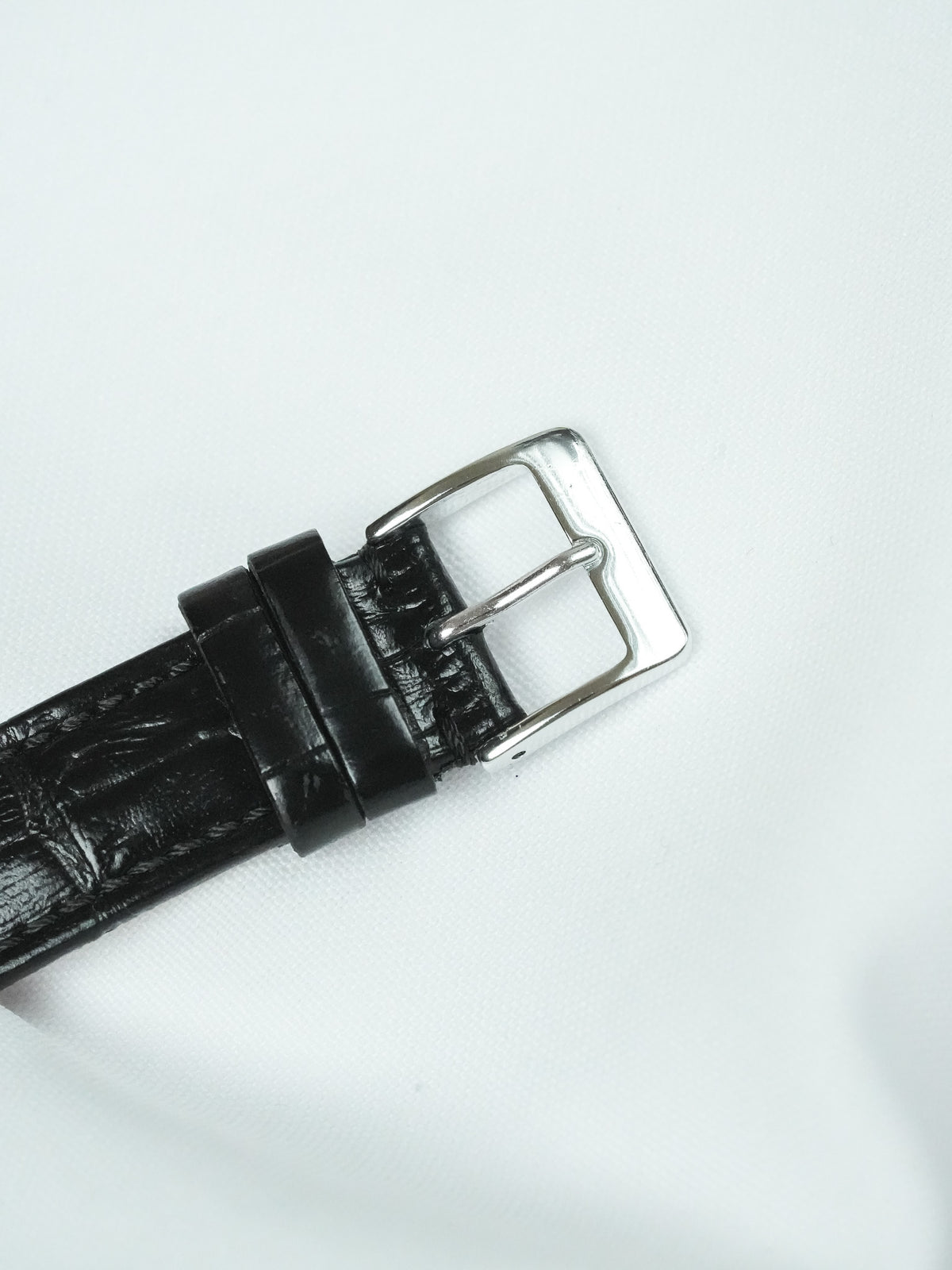 Black alligator leather watch strap with polished silver buckle