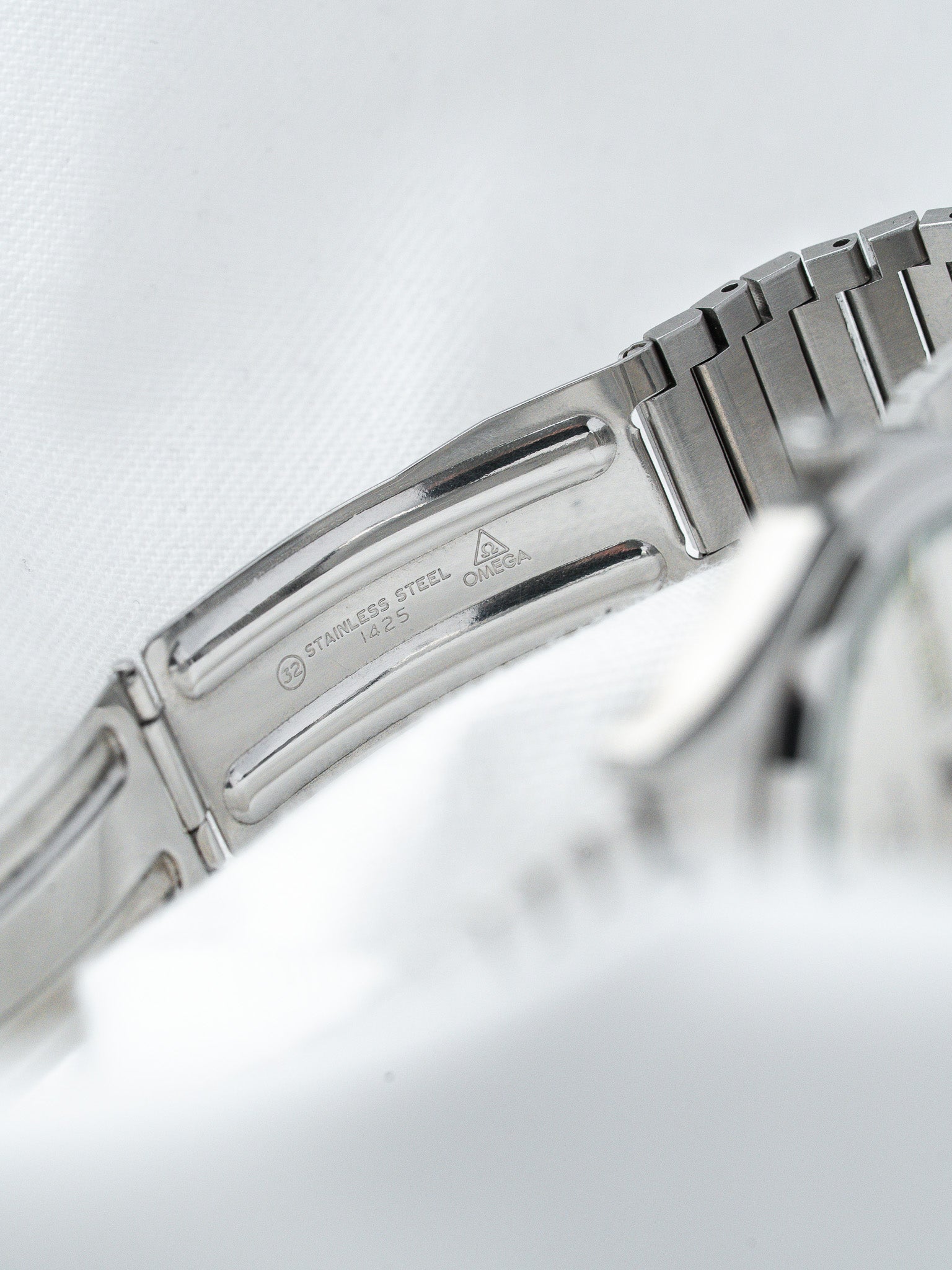Omega stainless steel bracelet clasp with engraved logo and model details