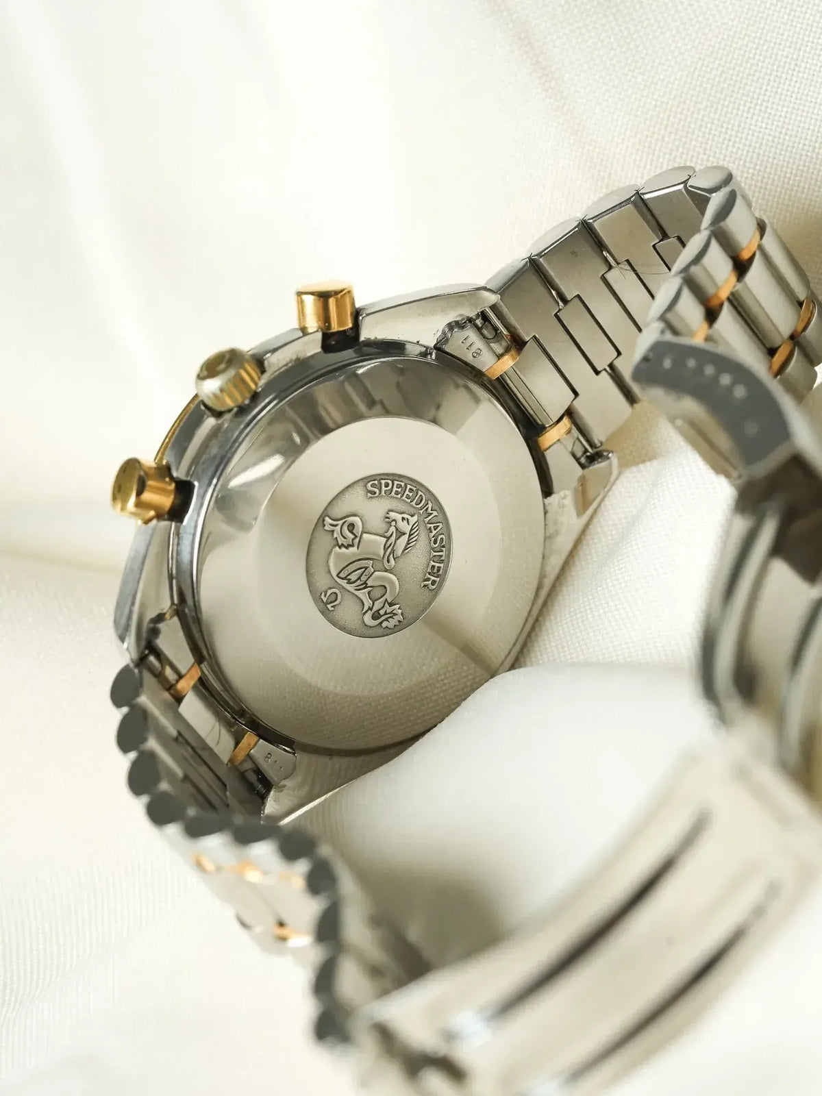 Omega Speedmaster vintage chronograph with steel and gold bracelet, case back engraved
