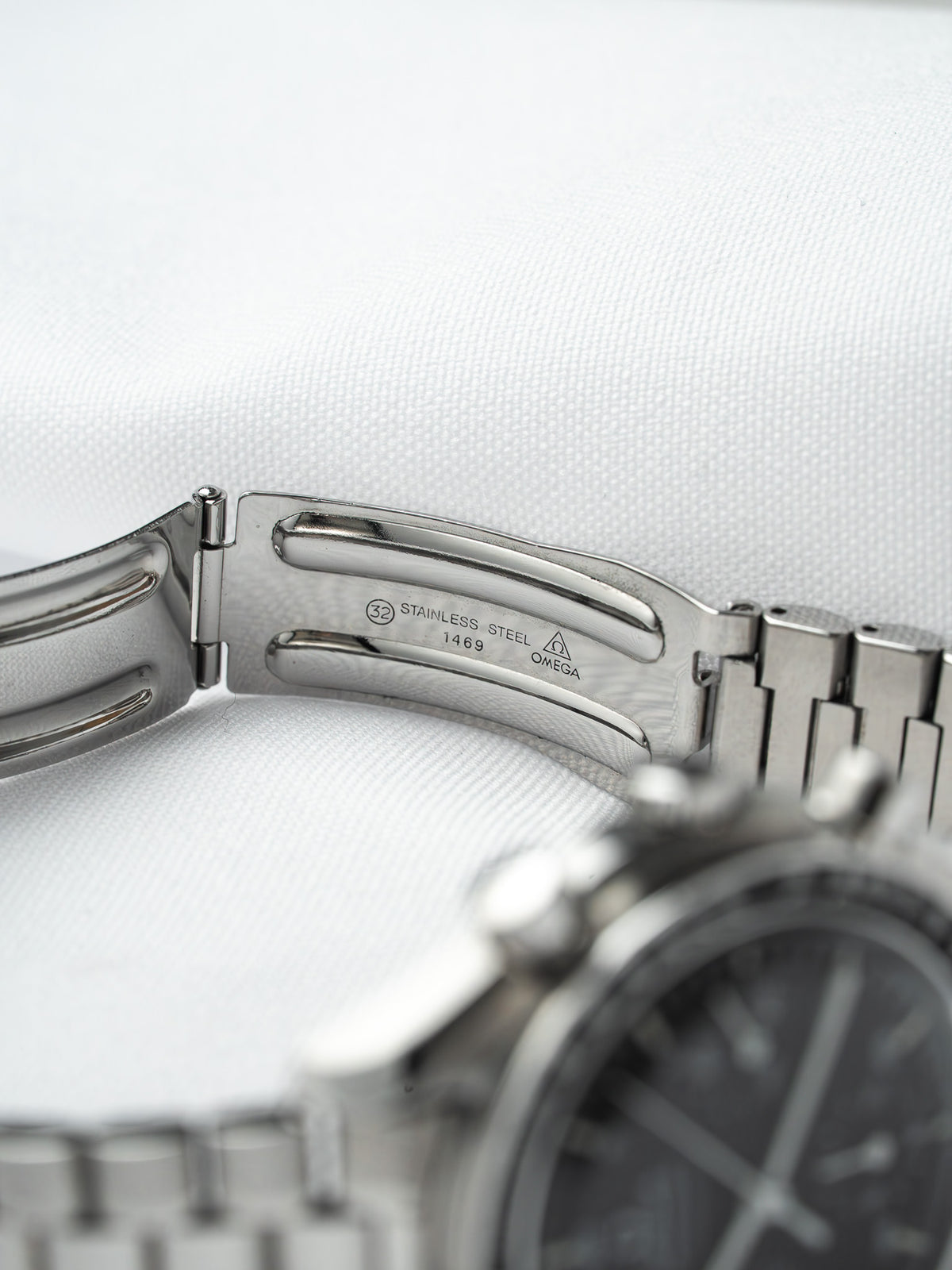 Omega stainless steel watch clasp with engraved logo and model details