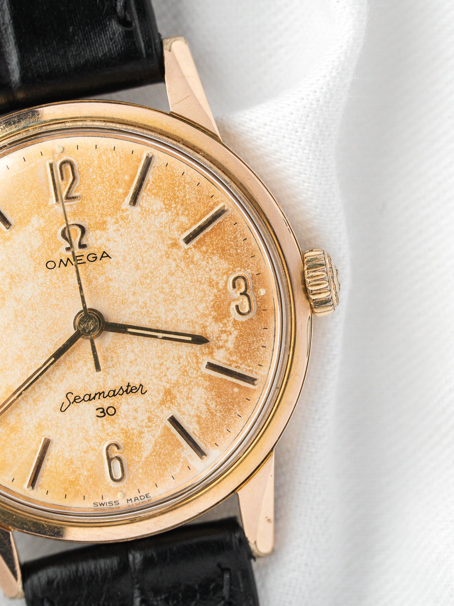 Vintage Omega Seamaster 30 watch with gold case, aged dial, black leather strap
