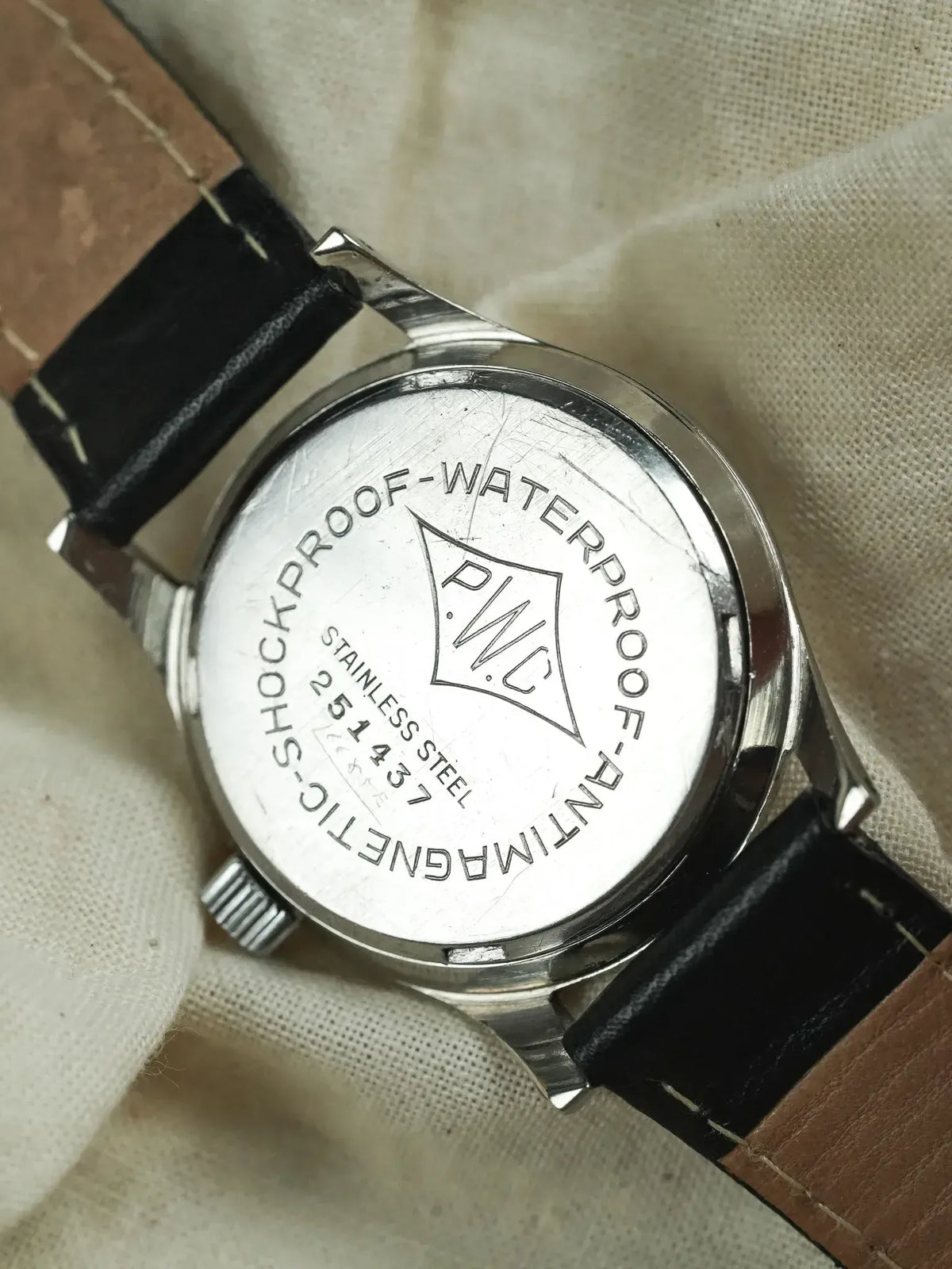 PWC vintage watch back, stainless steel, antimagnetic shockproof waterproof, black leather strap
