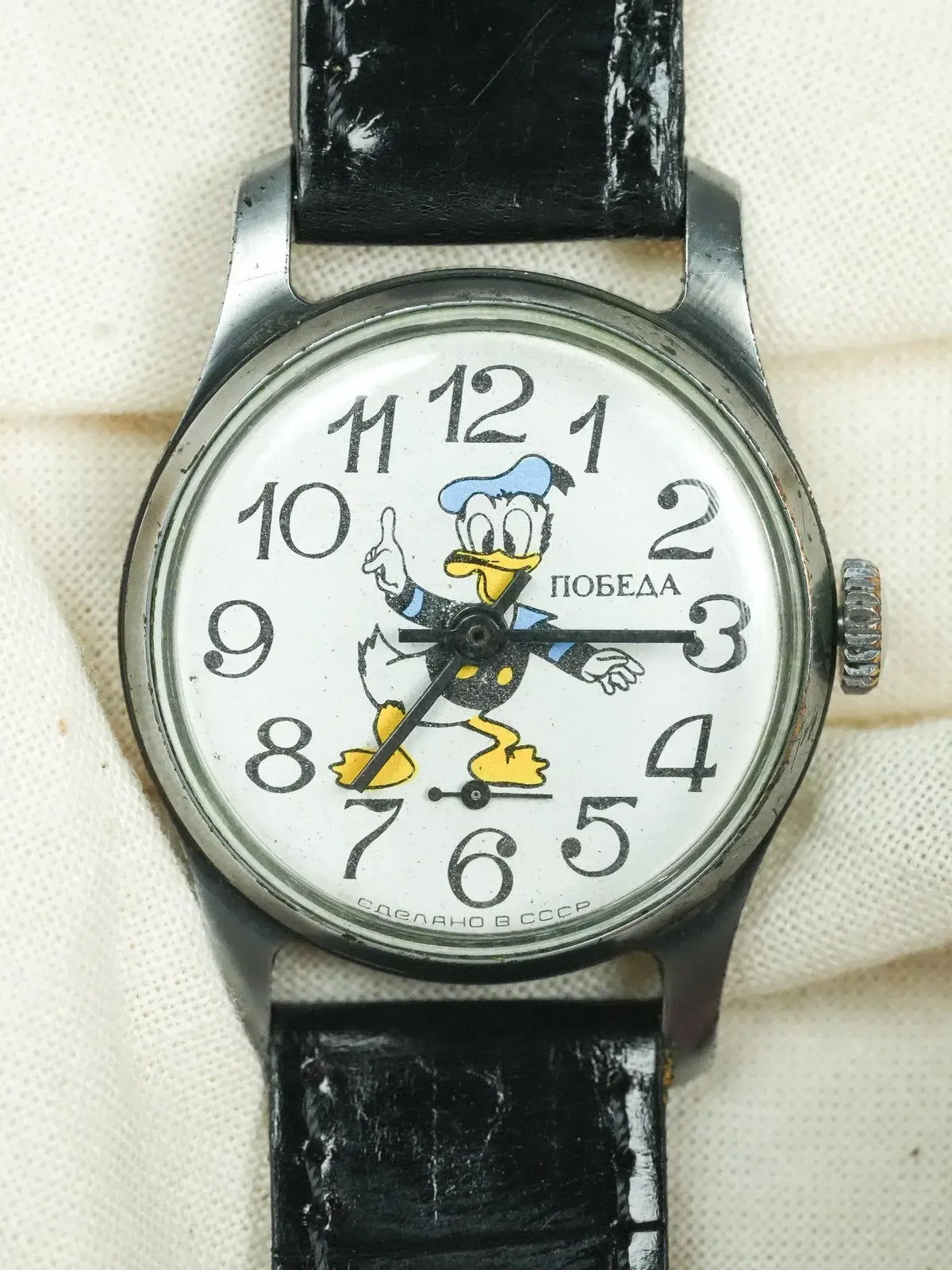 Vintage Pobeda watch with Donald Duck dial, black leather strap, USSR-made