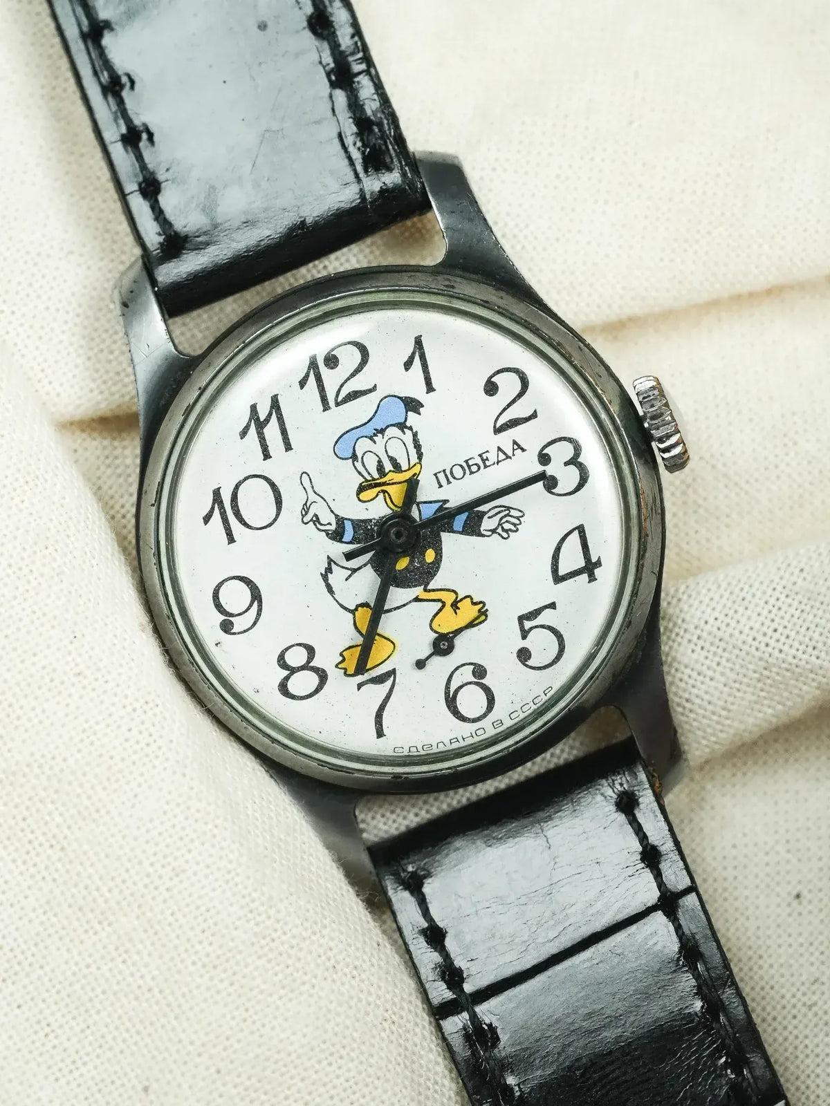 Vintage Pobeda watch with Donald Duck dial, black leather strap, USSR-made