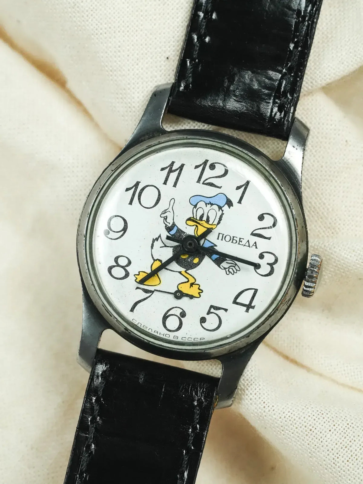 Vintage Pobeda watch with Donald Duck dial, black leather strap, USSR-made