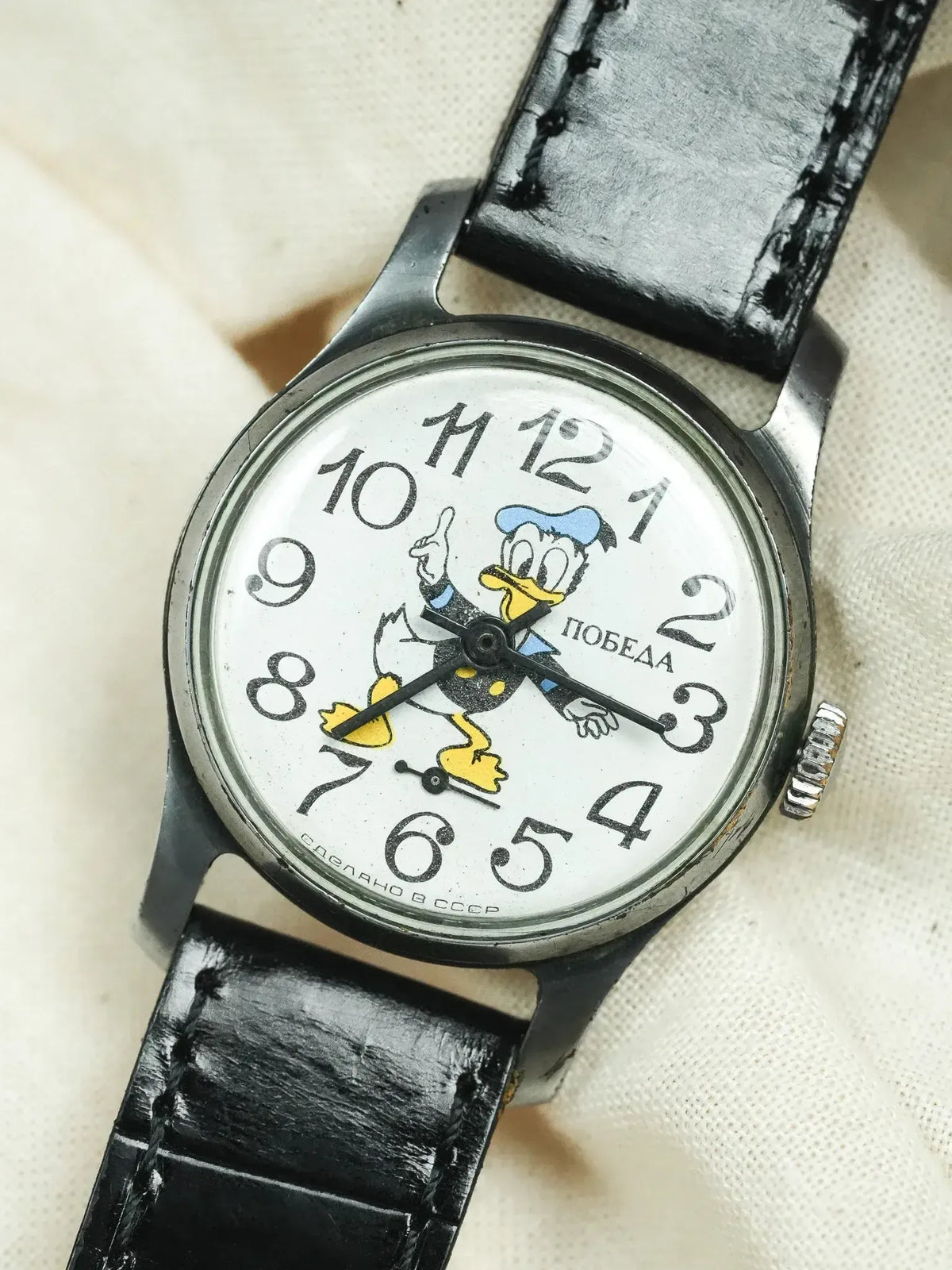 Vintage Pobeda watch with Donald Duck dial, black leather strap, USSR-made