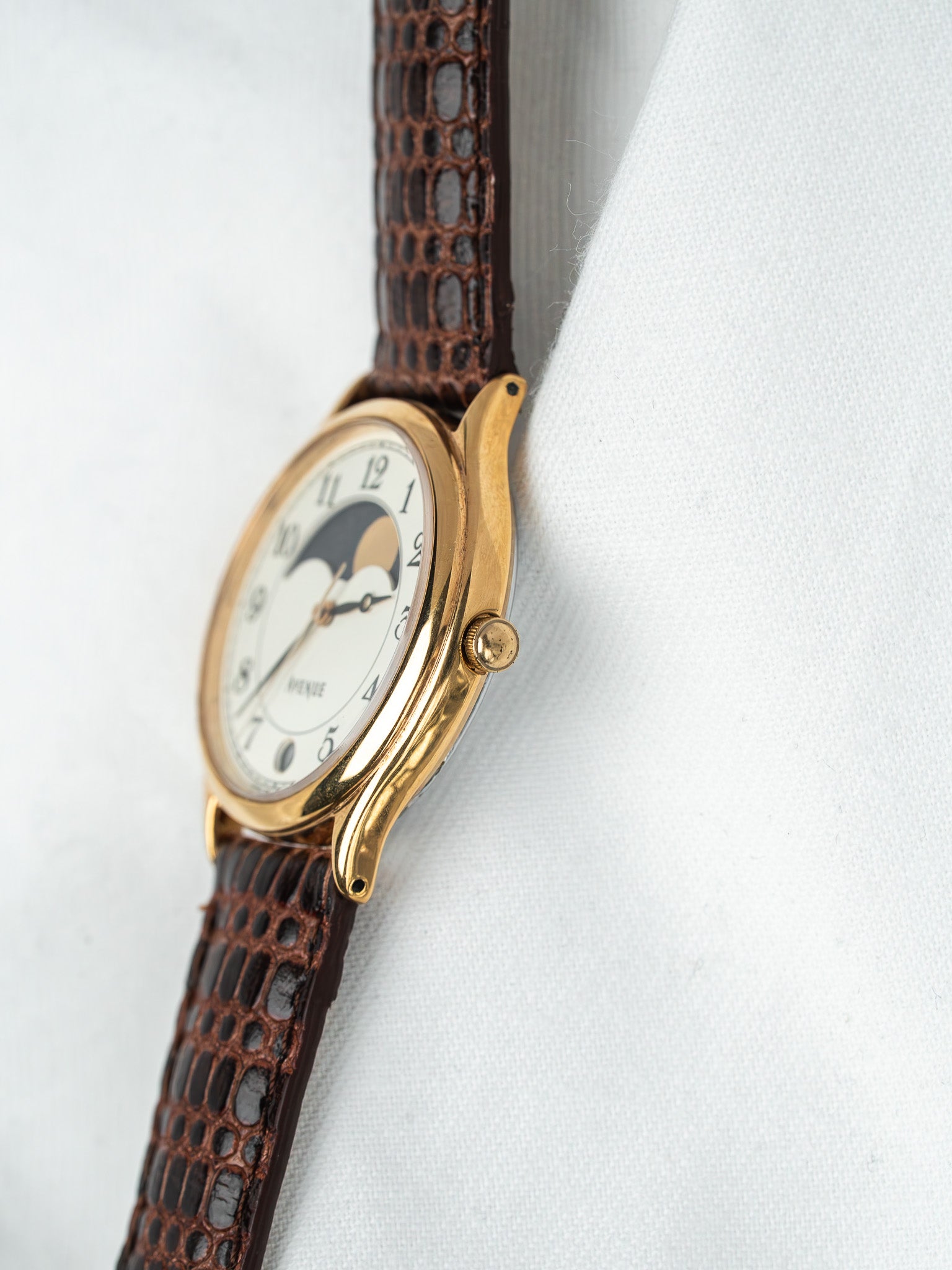 Universal Genève vintage watch with gold case, white dial, moon phase, brown alligator strap