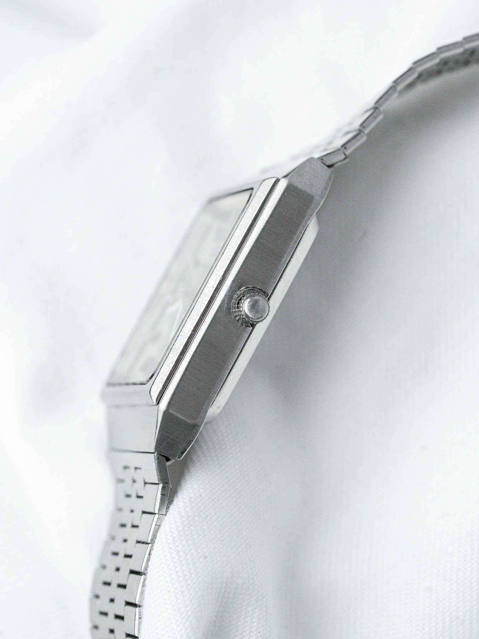 Vintage Omega watch with rectangular steel case and integrated bracelet