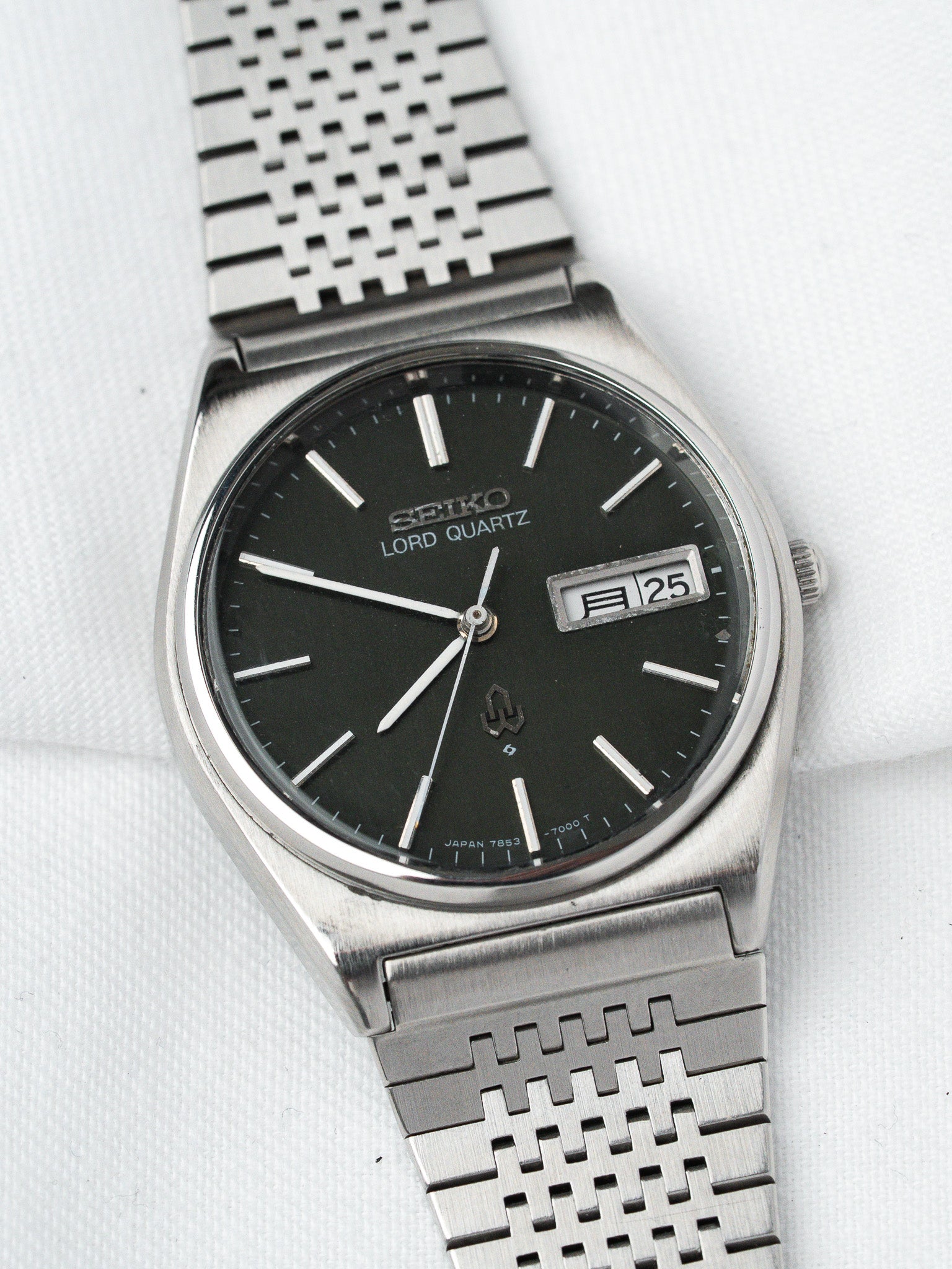 Seiko Lord Quartz vintage watch with black dial, steel mesh bracelet, date window