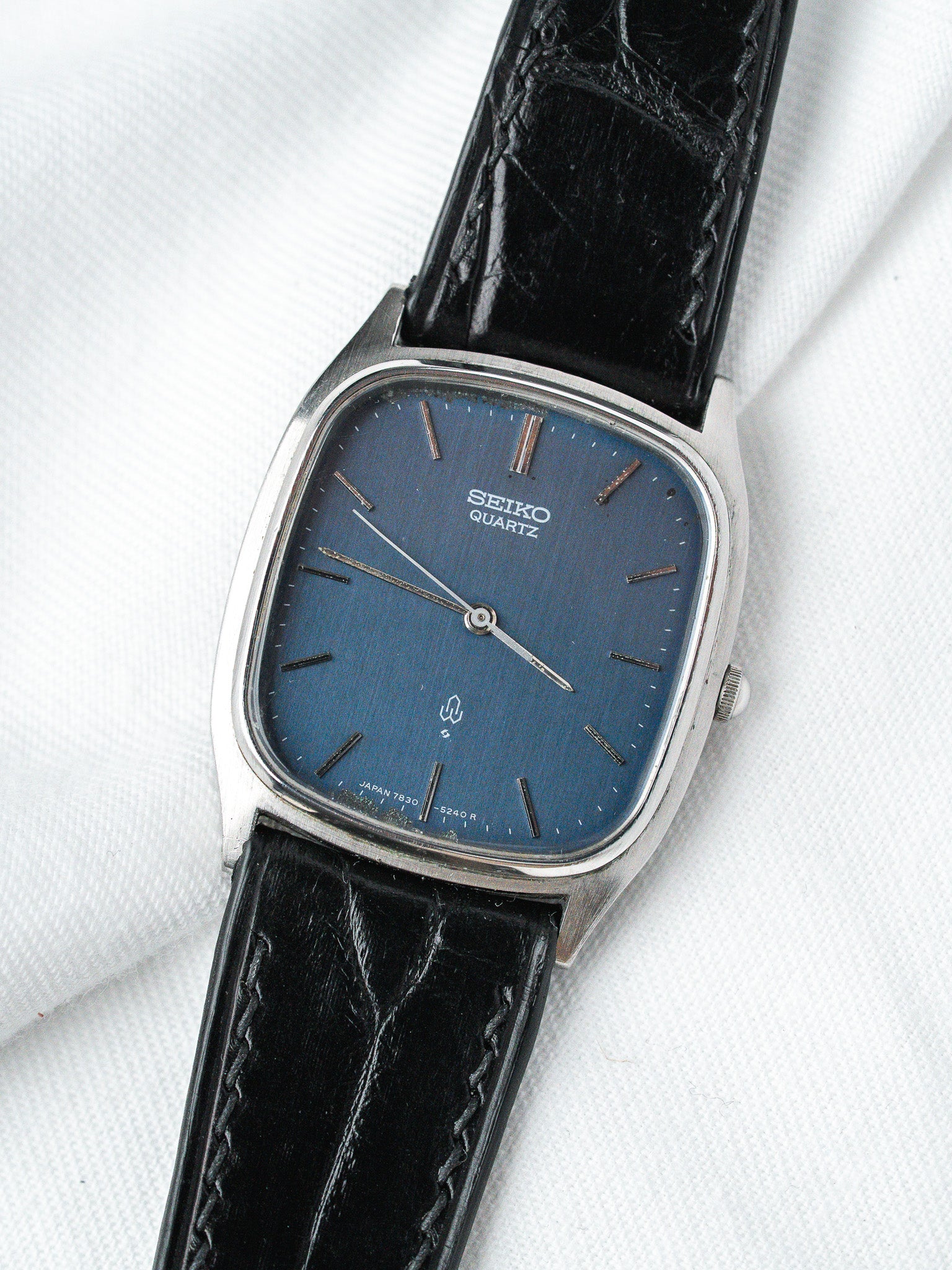 Seiko Quartz vintage watch with blue dial, black leather strap, silver case