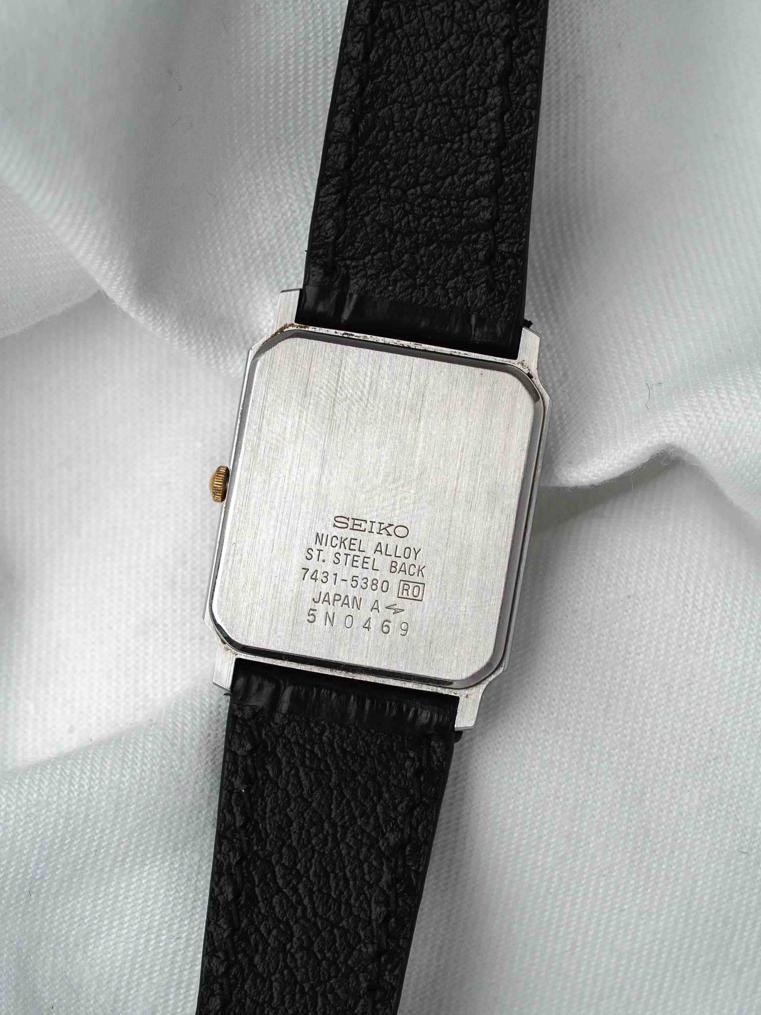 Seiko vintage watch with steel case back, black leather strap, Japan made