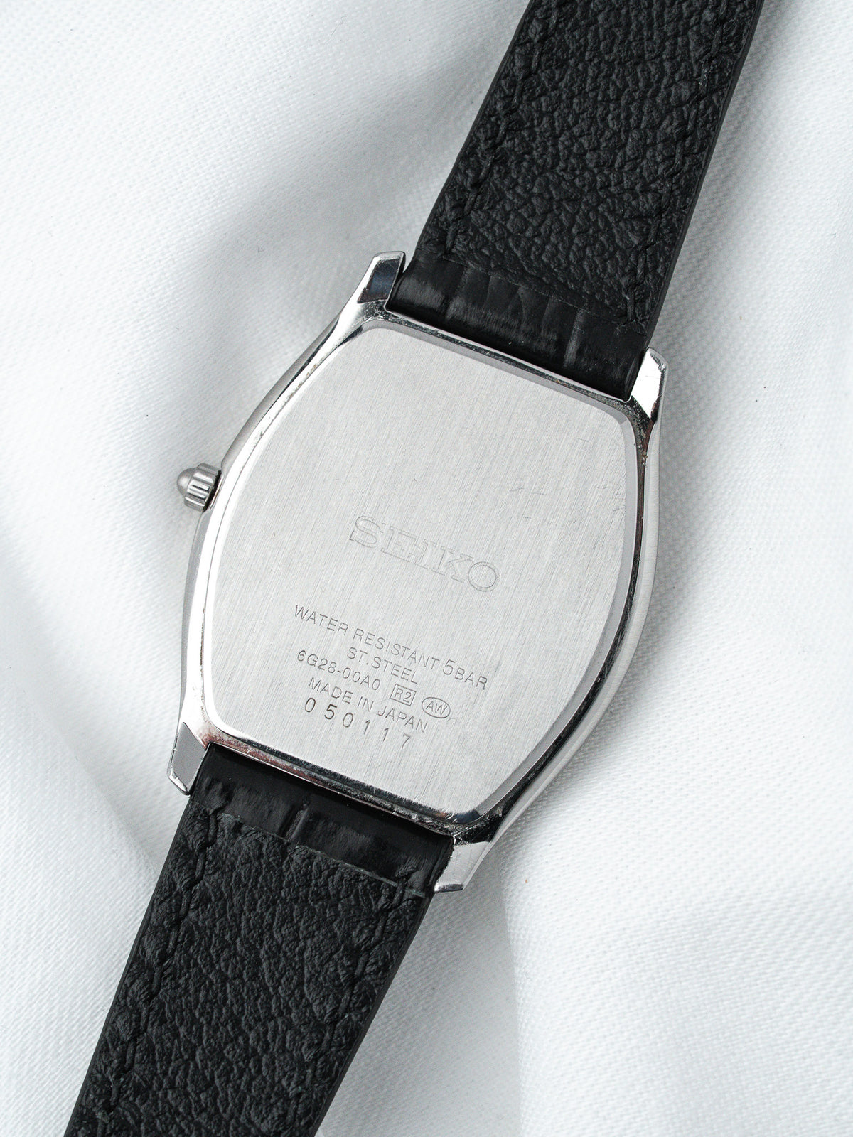 Seiko vintage watch back with stainless steel case and black leather strap