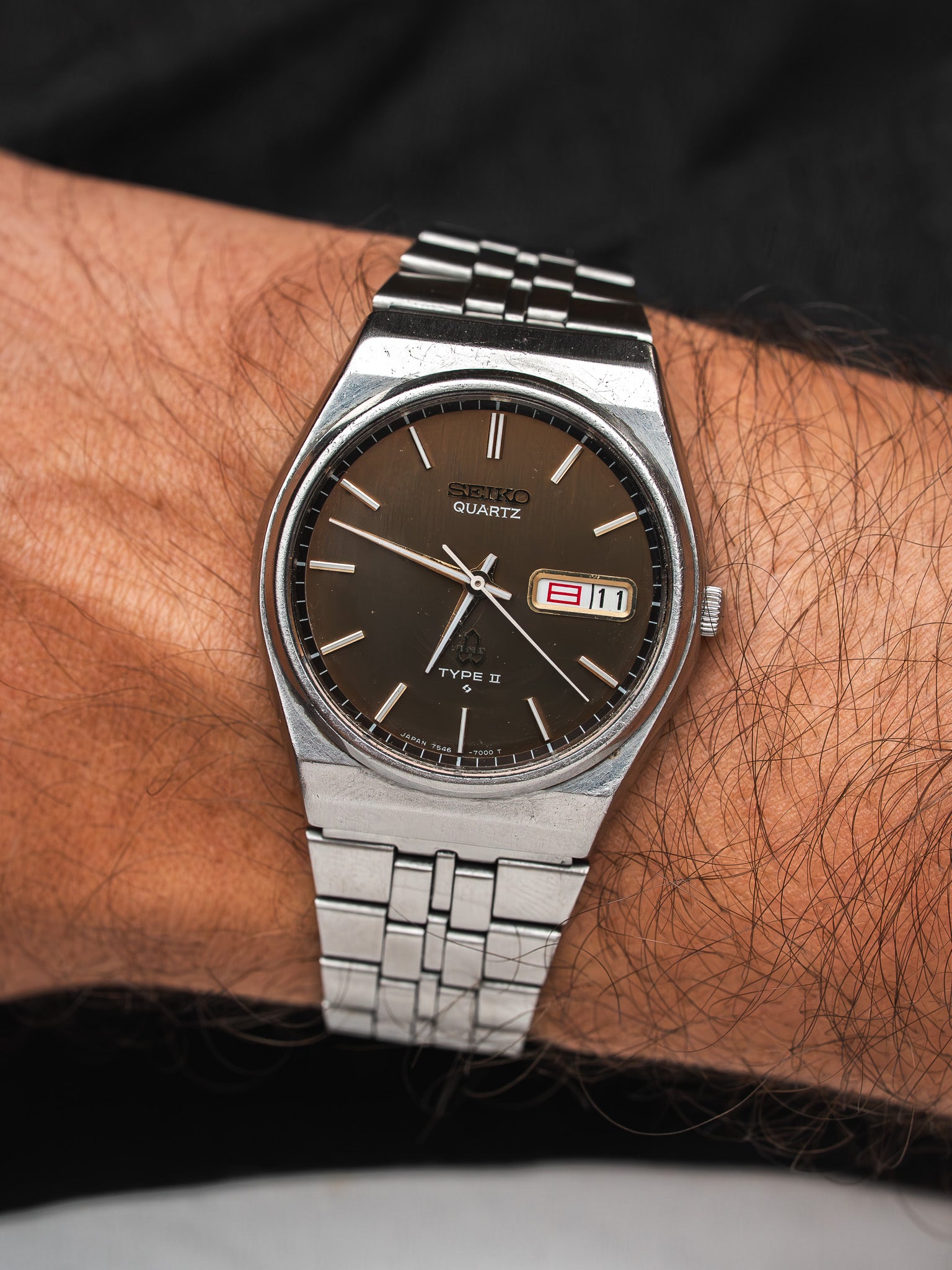 Seiko Quartz Type II vintage watch with brown dial and steel bracelet on wrist