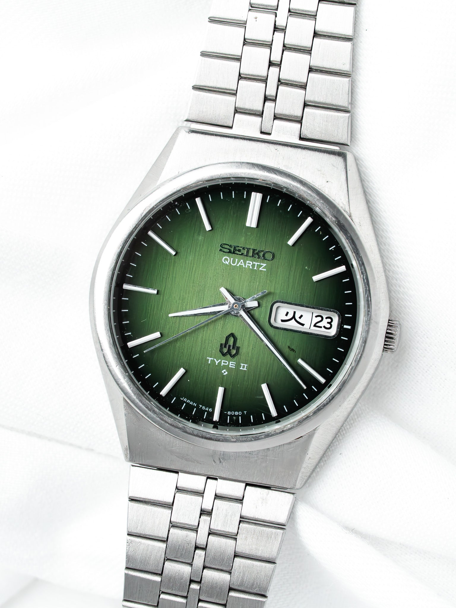 Seiko Quartz Type II vintage watch with green dial and steel bracelet