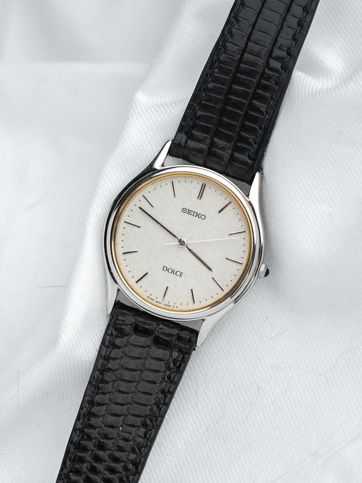 Seiko Dolce vintage watch with silver dial and black textured strap