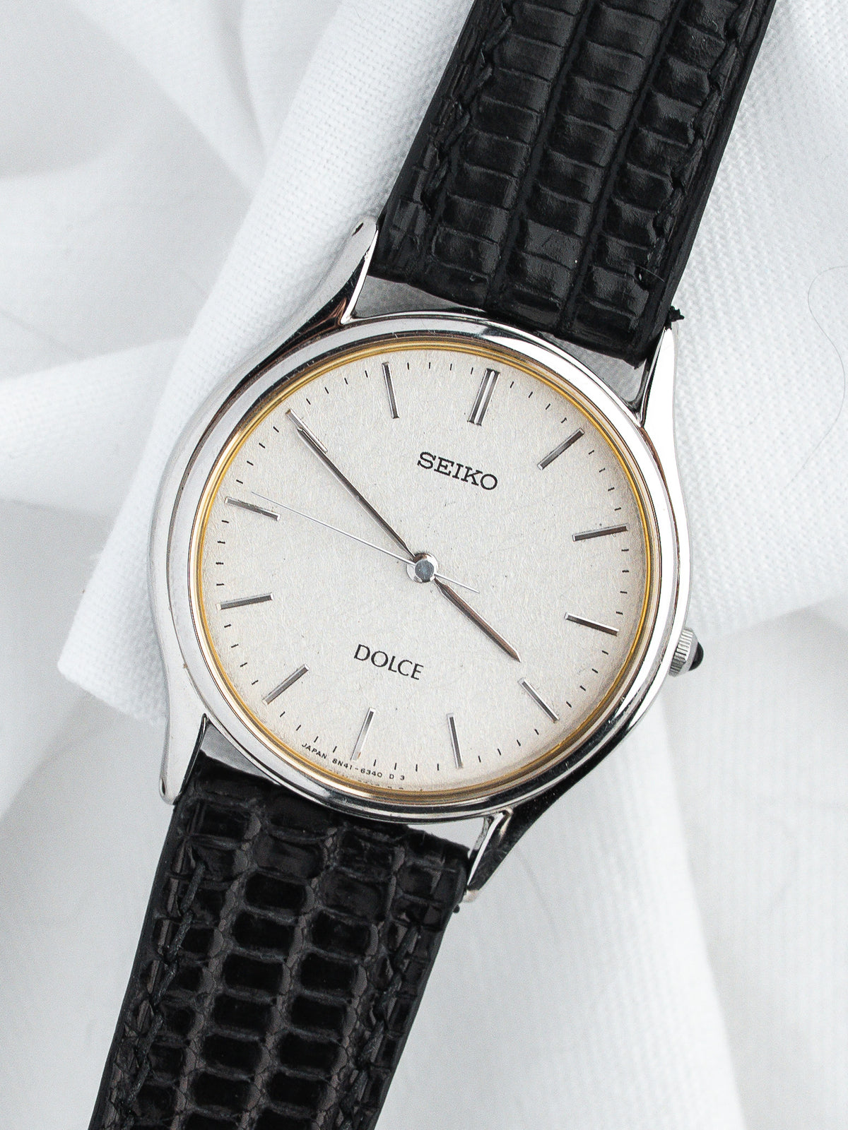 Seiko Dolce vintage watch with silver dial and black textured strap